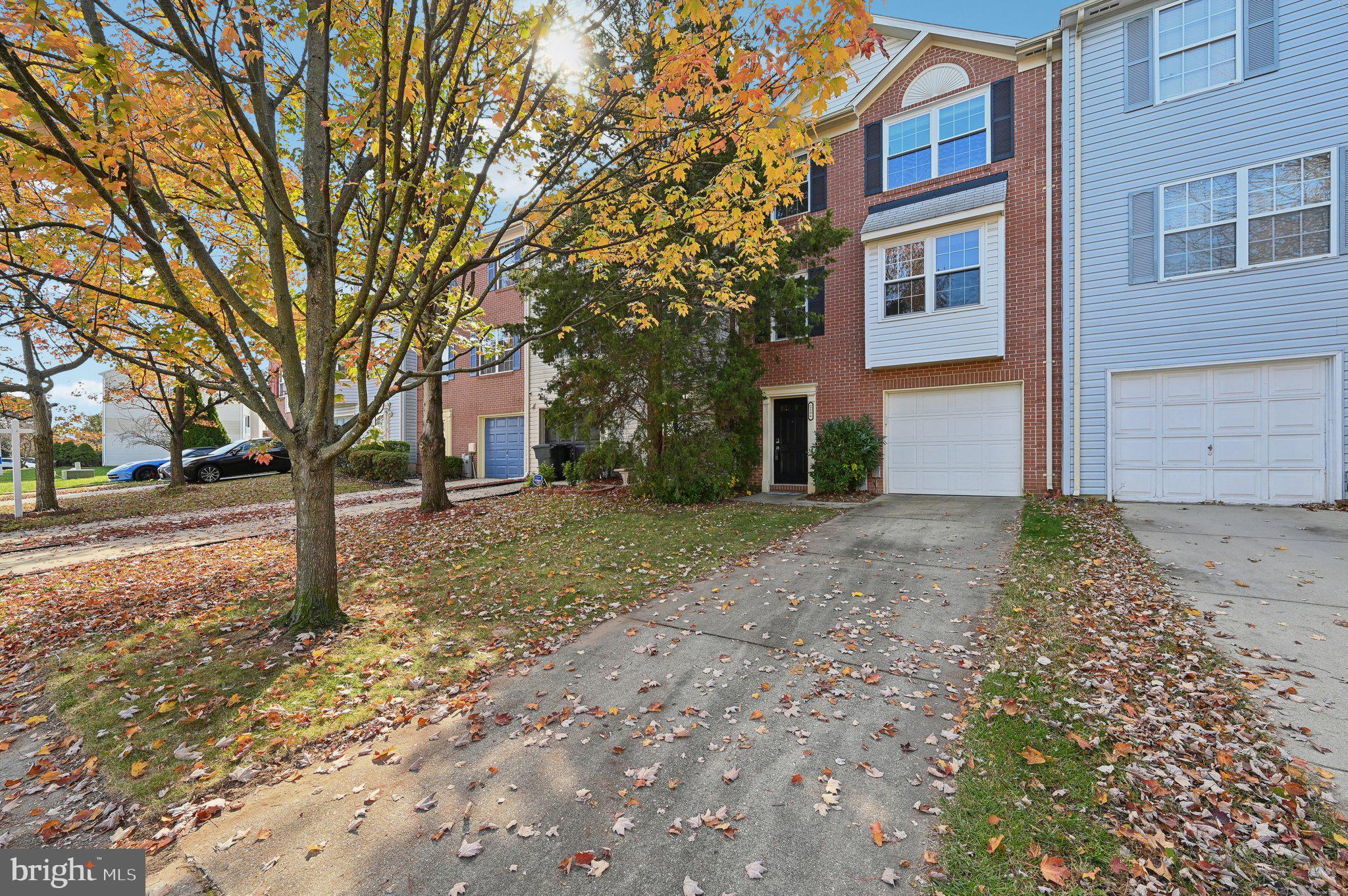 Welcome to this move-in ready brick-front townhouse in the desirable Seven Oaks community, where convenience meets comfort. With over 2,200 sq. ft. of living space, this home offers a front-facing, entry-level 1-car garage plus a 2-car driveway. The main level features a cozy carpeted family room, a laundry area, a walkout to a spacious backyard and inside access to the garage. Upstairs, the 1st upper level boasts wood floors, an open-concept kitchen with an island, a breakfast nook, and a spacious living and dining area that opens to a large deck, perfect for outdoor entertaining. The 2nd upper level offers three well-sized bedrooms, including a primary suite with a private en-suite bath, as well as an additional full bathroom. Located in a vibrant community with a low HOA, access to a refreshing pool, and just minutes from Rt. 32, this home is a perfect blend of style, space, and location. Don’t miss out on this fantastic opportunity!