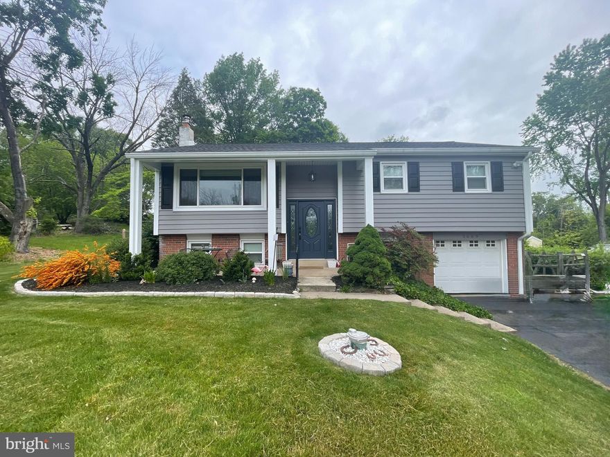 Welcome to this well-maintained split-level home offering comfort, functionality, and inviting living spaces both inside and out. A welcoming front porch and one-car garage add curb appeal and convenience. The main level features hardwood floors throughout the living room, dining room, kitchen, and hallway, complemented by recessed lighting in the living room that creates a bright and comfortable atmosphere. The updated kitchen includes an electric range, upgraded countertops, stone backsplash, stainless steel appliances, and a cozy eat-in corner perfect for a table and chairs. Also on the main level are three comfortable bedrooms, each with carpet and ceiling fans, along with a hall bathroom featuring a tub/shower combination. 

The lower level offers exceptional additional living space with vinyl plank flooring, recessed lighting, and a wood stove. Sliding glass doors lead directly to the patio and backyard, making it perfect for entertaining or relaxing. This level also features a bar area with a wet bar and pendant lighting, a convenient half bath, a flexible office or bonus room, and a large laundry room. Step outside to enjoy the large fenced backyard, complete with mature trees, a storage shed, and a patio just off the lower-level family room, providing a private outdoor retreat. 

Heat updated and central A/C added in 2020. This home offers a great balance of cozy living spaces, functional layout, and outdoor enjoyment – ready for its next owner to move in and make it their own. Minutes from 422 for easy convenience!