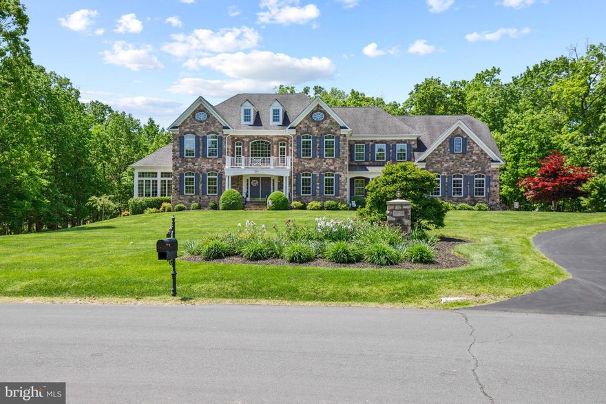 Exceptional opportunity to own breathtaking estate home on 3+ acres in Chantilly! Built with every possible addition, this home offers over 8,000 sqft of expansive living space across three levels. The meticulously maintained 6BD/6.5BA home (with a main level office/bedroom and full bathroom!) features exquisite wood floors throughout the main and upper levels. 

Upon entering, a dramatic two-story foyer with dual sweeping staircases welcomes you into the home. To your right is the impressive formal dining room, ideal for hosting elaborate dinner parties. To your left is the formal sitting room with access to the bright sunroom with three entire walls of windows. Enjoy the wooded views and natural light from the comforts of the indoors. As you walk into the heart of the home, the two-story family room overlooks the meticulously landscaped backyard and nearby woods. A relaxing space to gather around the fireplace with loved ones. The commanding gourmet kitchen boasts a 48-inch professional gas range, 2 dishwashers, 3 ovens, a vast kitchen island, and miles of countertop space. Perfect for a passionate home cook (or personal chef!) to delight family and friends with five-star meals. Enjoy more intimate family meals in the breakfast room by the kitchen. Access the fantastic screened-in covered porch just off of the breakfast room. A stately executive office towards the back of the home (with a full bath!) provides privacy for work at home or used as a main level en-suite bedroom. Additional rear staircase between the family room and kitchen. Convenient half bath on main level and oversized laundry room.

Up the sweeping stairs, the palatial primary bedroom boasts its own sitting area separated by a double-sided fireplace, tray ceilings, a personal wet bar, and dual walk-in closets. A jacuzzi tub sits at the center of the spa-like primary bathroom, which features a separate extra-large shower with dual shower heads, two separate vanities, and a private toilet room. Three additional, spacious bedrooms each with their own ensuite bathroom. Convenient second laundry room located upstairs, as well.

The extensive finished lower level is perfect for a home gym, recreational space, and/or additional office space. Or all three! The lower level also includes another bedroom and full bath, a full bar, and access to the covered paver patio. Outside, an outdoor fireplace set the stage for rest and recreation. Attached 4-car garage with a sweeping driveway completes the home. 

Ideally situated to enjoy the best of both DC and the bucolic outdoors. Near Bull Run Stables, South Riding Golf Club, Pleasant Valley Golf Club, Chantilly National Golf & Country Club, and The Winery at Bull Run. Convenient access to 620/Braddock Road. Less than 20 min to the heart of Chantilly (Costco, Walmart Supercenter, restaurants, Dulles Expo Center, Wegmanâs, Target). 20 min to Dulles (IAD). 50 min to Downtown DC. Donât miss the incredible opportunity to own this immaculate estate home today!