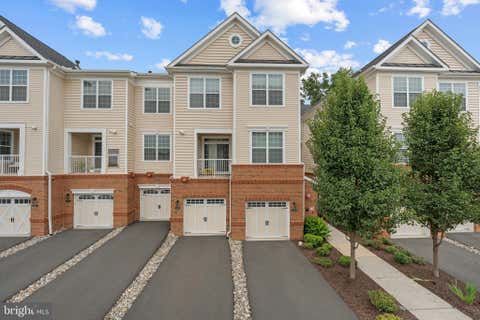 Photo of 23235 Milltown Knoll Square #107, ASHBURN, VA 20148 (MLS # VALO2130020)