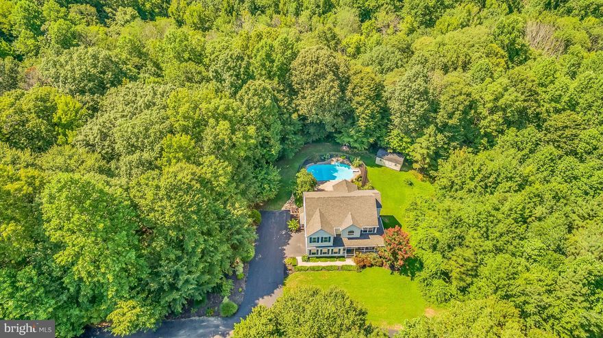 Beautiful 5 bd 3.5 ba Colonial on over 1.6 acres! Kick back in your outdoor oasis complete w/hardscaping, lrg deck, in-ground pool & frnt porch. HDWD throughout lvng rm, dining rm, foyer & bsmnt. Ktchn complete w/ granite countertops, backsplash, island, & ss appl. Add. Features include: ceramic tile, wainscoting, crown molding, gas fp, lrg storage shed, 2 car gar. soaking tub in mstr bed & more!