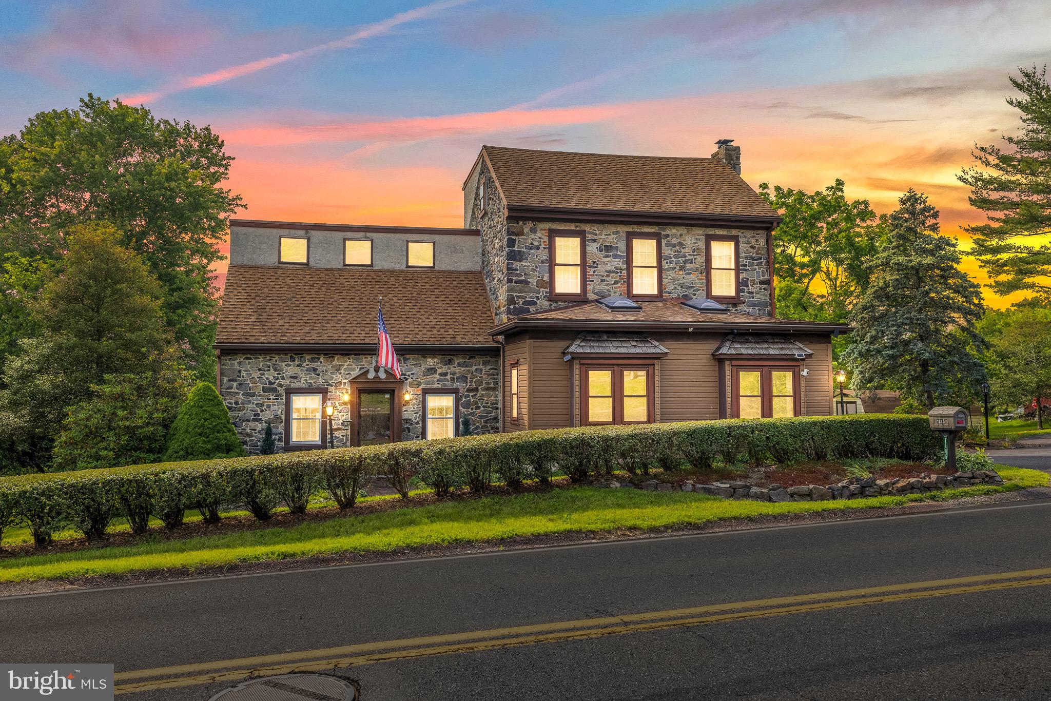It's not often that a true piece of HISTORY comes to the market. This is your chance to own your very own piece of Montgomery County history. This 1767 home was maintained and modified thoughtfully over the last four decades, offering the character you expect to see in a home from it's era, while creating the functionality of a home that works in today's world!
This expansive single-family residence located at 1445 Farmington Ave in Pottstown, PA offers 3,700 square feet of comfortable living space, thoughtfully designed to accommodate a modern lifestyle. With five spacious bedrooms and four bathrooms, this property ensures ample room for everyone to enjoy their personal space.
As you enter the home through the sunny entryway, you will find a space perfect for morning coffee or a bright home office. Into the original living room, you will find the original DEEP window sills and beautiful wood beams. The wood stove and built in bookshelves are beautiful AND functional!
Just past this living space to the left, you find the kitchen. Placed in the heart of the original home, this space has been updated to accommodate today's needs with stainless steel appliances, gas cooking, and a convenient center island. The additional part of the home begins here, as you move into the larger family room and dining area, which leads right out to the beautiful deck. From here, you can easily access the main floor laundry and the huge garage!
Upstairs, you will find a spacious ensuite with multiple closets as well. In addition to the wood and stone accents of the room, you will find vaulted ceilings and tall windows, letting in ample amounts of light! Adjacent, you will find a Jack-and-Jill Semi Suite, with a small sitting space, a private half-bath, and two generously sized additional bedrooms. This area offers access to a floored attic area, additional large closet space, and a laundry chute!
Just down the hall you will find the full hall bathroom, just before the fourth bedroom, which is very spacious and offers yet another walk-in closet.
Up one last level, you will find the fifth loft-style bedroom, with enough space for three twin beds and tons of storage /closet space. WOW!
Just as the inside of the home offers immense living space, the outside of the home is equally as impressive. Featuring a large deck, overlooking a beautiful above ground pool, a paved patio, and almost an acre of land for you to use as your heart's desire!
This remarkable property at 1445 Farmington Ave is a true gem in Pottstown, blending comfort, elegance, and practical living. Don’t miss the opportunity to make this exceptional house your home. Schedule a viewing today and envision the lifestyle that awaits you in this magnificent residence.