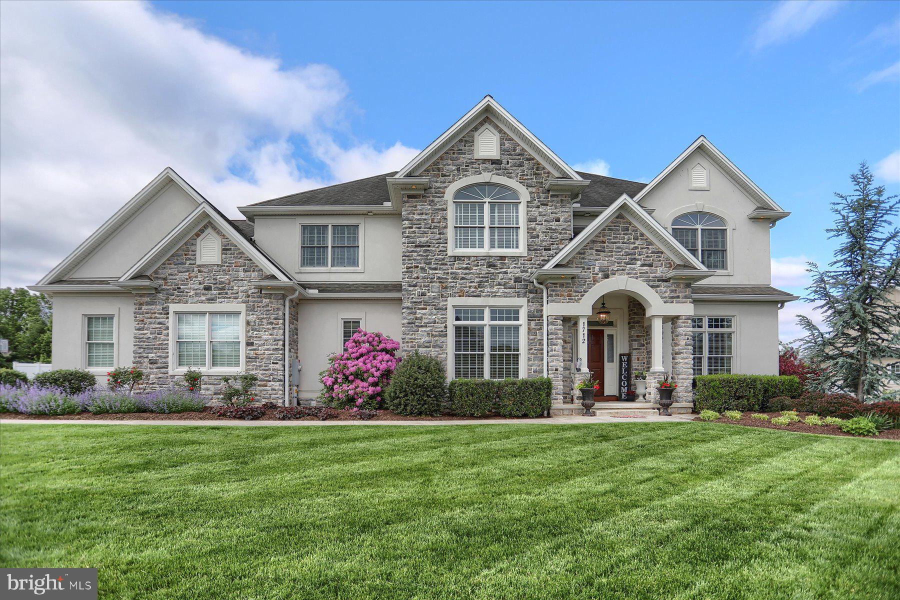 Welcome to 1712 Morning Star Ct, located in the highly desirable Meadowview Estates. This exceptional custom-built home by Farinelli offers unmatched craftsmanship, timeless design, and luxurious features throughout. Step into the private office, complete with french doors, solid wood built-ins, and a wood-accent wall—perfect for working from home. The formal dining room showcases hand-crafted wainscoting, ideal for elegant gatherings. The heart of the home is the expansive two-story great room, anchored by a stunning floor-to-ceiling stone fireplace. The gourmet kitchen is a chef’s dream, featuring granite countertops, a tile backsplash, pot filler, walk-in pantry, oversized center island, and a light-filled eat-in area surrounded by windows. Function meets style in the custom mudroom with built-in lockers. Upstairs, the luxurious primary suite offers breathtaking mountain views, a spa-like bath with a walk-in tile shower, soaking tub, and the closet of your dreams. An additional bedroom includes a private en-suite and walk-in closet, while two more spacious bedrooms share a well-appointed hall bath.The finished lower level boasts new luxury vinyl plank flooring and a home theater area—perfect for movie nights or hosting friends. Step outside to your backyard oasis featuring a heated saltwater pool, built-in grill, fire pit, and a covered paver patio. Whether you’re enjoying a quiet evening or entertaining a crowd, this home has it all. Backs to a local park and within walking distance to schools—this prime location offers both privacy and convenience. Don’t miss the opportunity to call this exquisite property your forever home!