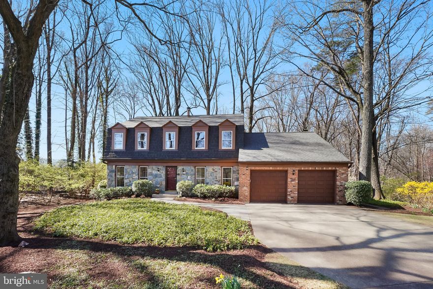 Major Price Improvement! Nestled on a tranquil, tree-lined street in the highly sought-after Stratton Commons neighborhood, this beautifully maintained 4-bedroom, 3.5-bathroom colonial boasts over 3,802 square feet of refined living space. From the moment you arrive, you’ll be captivated by its charming curb appeal and private location featuring a stunning stone and brick elevation, lush landscaping, and a sprawling half-acre lot.

Step inside to discover a sun-drenched living room with elegant French doors, a formal dining room, and a dedicated study—perfect for a home office. The chef’s kitchen is a standout, featuring custom hand-crafted maple cabinetry, gleaming granite countertops, and stainless-steel appliances. Adjacent to the kitchen, the breakfast room opens to a spacious deck and patio, seamlessly blending indoor and outdoor living. The inviting family room, with a wall of glass doors, leads to an expansive screened-in porch—an idyllic retreat for your morning coffee or evening glass of wine. A renovated powder room and dedicated laundry room complete the main level.

Upstairs, the primary suite is a true sanctuary, offering a private sitting area, a luxurious marble spa-like bathroom, with a spacious shower and heated towel rack. Three additional generously sized bedrooms share an updated hall bath, showcasing a stunning Taj Mahal quartzite vanity and custom tile.

The fully finished lower level provides incredible versatility with a large open space, a full bath, and a generous storage/utility area—ready to be customized to suit your needs.
Recent Upgrades & Features include:
New Roof (2024)
New Garage Doors (2021)
Professionally Landscaped (2019)
New Water Heater (2021)
Full Home Insulation Upgrade (2019)
Kitchen (2009) & 3 Bath Renovations (2017)
HVAC Service Contract to convey to new Buyers - through Dec. 2025

Enjoy the best of Bethesda living with easy access to I-495, I-270, Metro, NIH, upscale dining, boutique shopping, and the renowned Strathmore concert hall—celebrated for its pitch-perfect acoustics.
This exquisite home is a rare find—don’t miss your chance to make it yours!