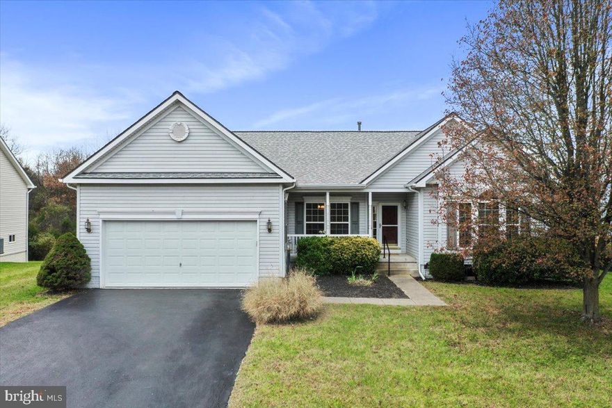 OPEN HOUSES Nov. 23 at 9-11am and 3-4:30pm.  The seller has worked to make this home move-in ready for you! Enjoy fresh PAINT and plush CARPET on the main level, plus also a NEW ROOF and hot water tank in 2024. This “home-sweet-home” has an excellent main level floor plan, with a spacious owner’s suite on one end of the house and two guest bedrooms and a second bathroom on the opposite side. In between, the eat-in kitchen opens to the fireplaced family room; the foyer connects to the formal living and dining rooms; and the laundry area serves as a pass-through to the garage. Extending across the rear of the house, the spacious deck is accessed from both the kitchen and the primary bedroom. Are you looking for even more flexible space? The cavernous basement includes a finished 800 sq ft bonus room, full bath, and 540 sq ft walk-out storage area. You will find mature landscaping and a manageable garden in the front yard, and common area lawn behind the backyard. The Stonebridge neighborhood includes a community pool and tennis courts, with an adjacent 9-hole golf course and affiliated Sycamore restaurant.  For your shopping convenience, Martinsburg center is less than 10 minutes away, and Shepherdstown is merely a 15 minute drive. The seller is the original owner and has taken good care of the house, including upgrading the HVAC six years ago. Now it is your turn for easy one-level living in this sought after community. (Floor plans available.) Welcome home for the holidays!