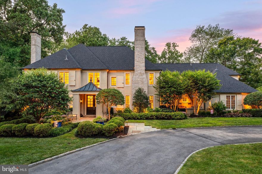 Welcome to 936 Roscommon Road, a stunning Colonial-style home in historic Bryn Mawr, offering over 5,000 sq/ft of luxurious living space with 5 bedrooms, 4 full baths, and 3 half baths. This private estate, nestled on over an acre of lush grounds, makes a grand first impression with its horseshoe drive and manicured landscaping. Step inside a light-filled 2-story foyer that opens to the formal living room, featuring a gas fireplace, coffered ceiling, and hardwood floors that extend throughout the main level. The adjoining office provides a quiet and sophisticated workspace enhanced by a coffered ceiling and wainscoting, as well as access to the slate patio with hot tub — a perfect place to relax after a long day. The formal dining room, complete with picture frame molding and chandelier is a sophisticated space to dine, and the adjoining Butlers Pantry makes entertaining a breeze. Across the foyer is a cozy sitting area with a gas fireplace and sliding glass doors leading to another slate patio, perfect for enjoying your morning cup of coffee. The adjoining gourmet kitchen is a chef's dream, boasting raised panel cabinetry with crown molding, granite countertops, tile backsplash, a butler's pantry, built-in desk, an oversized island with seating, and high-end appliances, including a paneled refrigerator, double wall ovens, and a six-burner gas range. The bright and sunny dining area, with French doors leading to the deck, flows seamlessly into the adjoining family room featuring a vaulted ceiling, a gas fireplace with built-ins, an oversized window with bench seating, as well as another set of French doors opening to the back deck, creating a perfect gathering space for family and friends. A convenient laundry room and two half baths complete this level. Upstairs, the open landing leads to the spacious primary suite, a luxurious retreat with a wood-burning fireplace, built-in shelving with bench seating, and a spa-like bath. The primary bath indulges with a dual vanity, make-up vanity, glass-enclosed shower, and a separate jetted tub. Three additional bedrooms with recessed lighting, ceiling fans, ample closet space, and two full baths, including a "Jack and Jill" with skylight, and a full hall bath with glass-enclosed shower/tub combo & dual vanity, complete the second level. The fifth bedroom is a cheery suite, above the 2-bay garage, with its own full bath, and is perfect for a guest, au pair, or in-law suite. The finished basement provides additional flexible living space, including a media room, exercise room, half bath, and ample storage space. Out back, discover your own private oasis. The expansive outdoor space features a wooden deck and slate patio, a heated saltwater in-ground pool with hot tub, and plenty of space to lounge and entertain in a serene setting. Located on the distinguished Main Line, this home is within the award-winning Lower Merion School District. Enjoy easy access to Conshohocken State Road and I-76, with major shopping, restaurants, golf courses, and all that Bryn Mawr has to offer. Don't miss this incredible opportunity to live in this truly spectacular home!