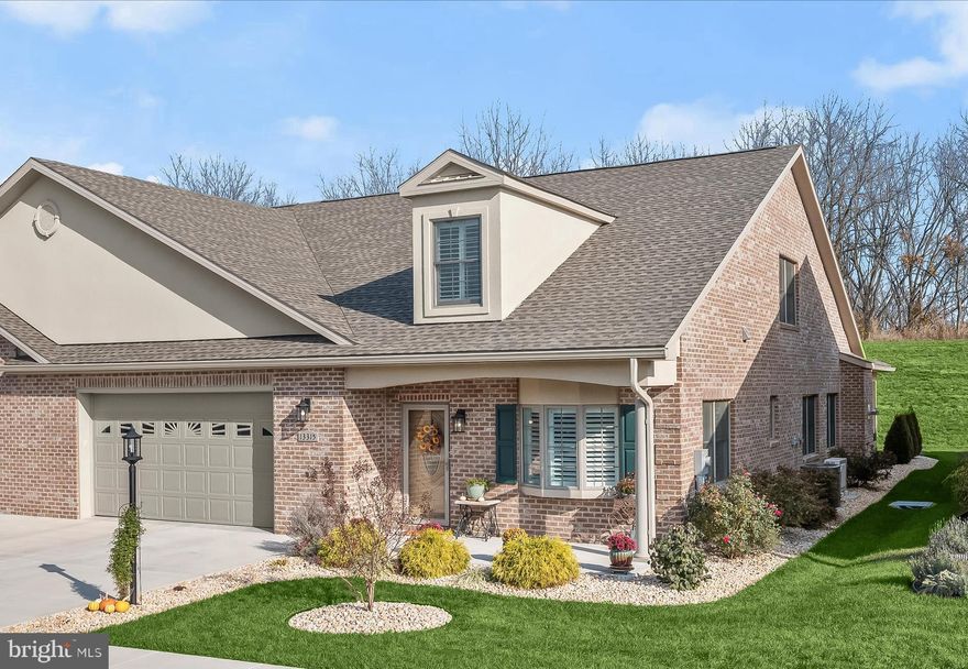Welcome to 13315 Diamond Pointe Drive, a beautifully crafted home in the sought-after 55+ community of Emerald Pointe in North Hagerstown. This exquisite all-brick residence showcases meticulously maintained living spaces, enhanced with high-end custom updates.

Inside, you'll find timeless elegance with classic moldings, custom-fit plantation shutters, soaring 9’ ceilings, and a three-zone HVAC system. Rich luxury vinyl plank flooring and plush carpeting create a warm and inviting atmosphere.

Step into the welcoming foyer, which leads to a private office featuring built-in cabinetry and a pocket French door—perfect for remote work or personal projects. The stunning eat-in kitchen is a chef’s dream, complete with custom soft-close cabinetry, gleaming Quartz countertops, top-of-the-line stainless steel appliances, a decorative backsplash, a center island with breakfast bar, and a spacious pantry. Seamlessly flowing into the dining area, this space is ideal for entertaining.

Anchoring the extended living room is a cozy stacked-stone fireplace, with access to a screened patio—perfect for outdoor relaxation. The main-level primary suite is a peaceful retreat, featuring a spa-like en-suite bath with dual vanities, an oversized custom-tiled walk-in shower, solar tube lighting, and a spacious walk-in closet. This level also includes a second bedroom, a full bath, and a well-appointed laundry room with Quartz countertops and direct access to the garage, which boasts epoxy floors, built-ins, and granite counters.

Upstairs, the home offers a second primary suite, a versatile bonus room, and ample storage.

As part of Emerald Pointe, residents enjoy access to a vibrant clubhouse with a commercial kitchen, pool table, grand piano, game room, indoor saltwater pool, fitness classes, pickleball courts, and more! The association fee covers lawn and shrub maintenance, snow removal, trash, and recycling—ensuring a maintenance-free lifestyle.