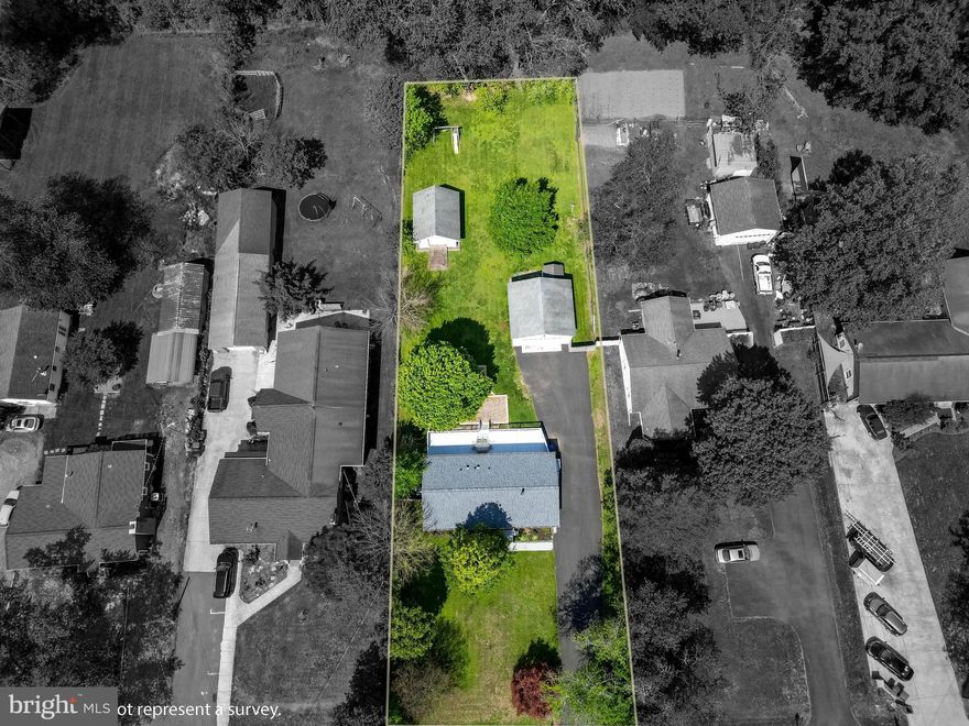 Exceptionally well-maintained 3BR/2BA rancher offering MAIN LEVEL LIVING and the perfect combination of comfort and functionality. The true standout of this property is the exceptional outdoor setup: An oversized detached 2 car garage with electricity and an additional 1 car garage with ramp. Plenty of room for RV, camper, boat so bring all your toys!  Plenty of height for a lift or RV storage. Ideal for hobbies, workshop space, equipment, or additional storage. Maybe even additional work or living space. 
The expansive mostly fenced backyard also includes a large brick patio, fire pit area, additional storage shed, and plenty of room to garden, play, or entertain. A long paved driveway provides abundant off-street parking for vehicles, trailers, boats, or guests. Situated on a beautifully manicured 1/2-acre lot, this move-in ready home features major recent updates including a new roof & gutters (2025), new hot water heater (2025), updated heat pump & air handler (2024), and new LG washer/dryer combo. 
Inside, enjoy an updated kitchen with Silestone countertops, maple cabinetry, hardwood floors, exposed wood beams, and spacious living areas filled with charm. Bedrooms feature comfortable carpeting, and the large freshly painted deck is perfect for relaxing or entertaining. There's also a cedar closet in hallway. 
No HOA! Enjoy peaceful living in a charming neighborhood while remaining conveniently close to shopping, dining, and major commuter routes. Just move in and enjoy! Metal swing set and metal shed sold as-is. FLOORPLAN IN PICTURES