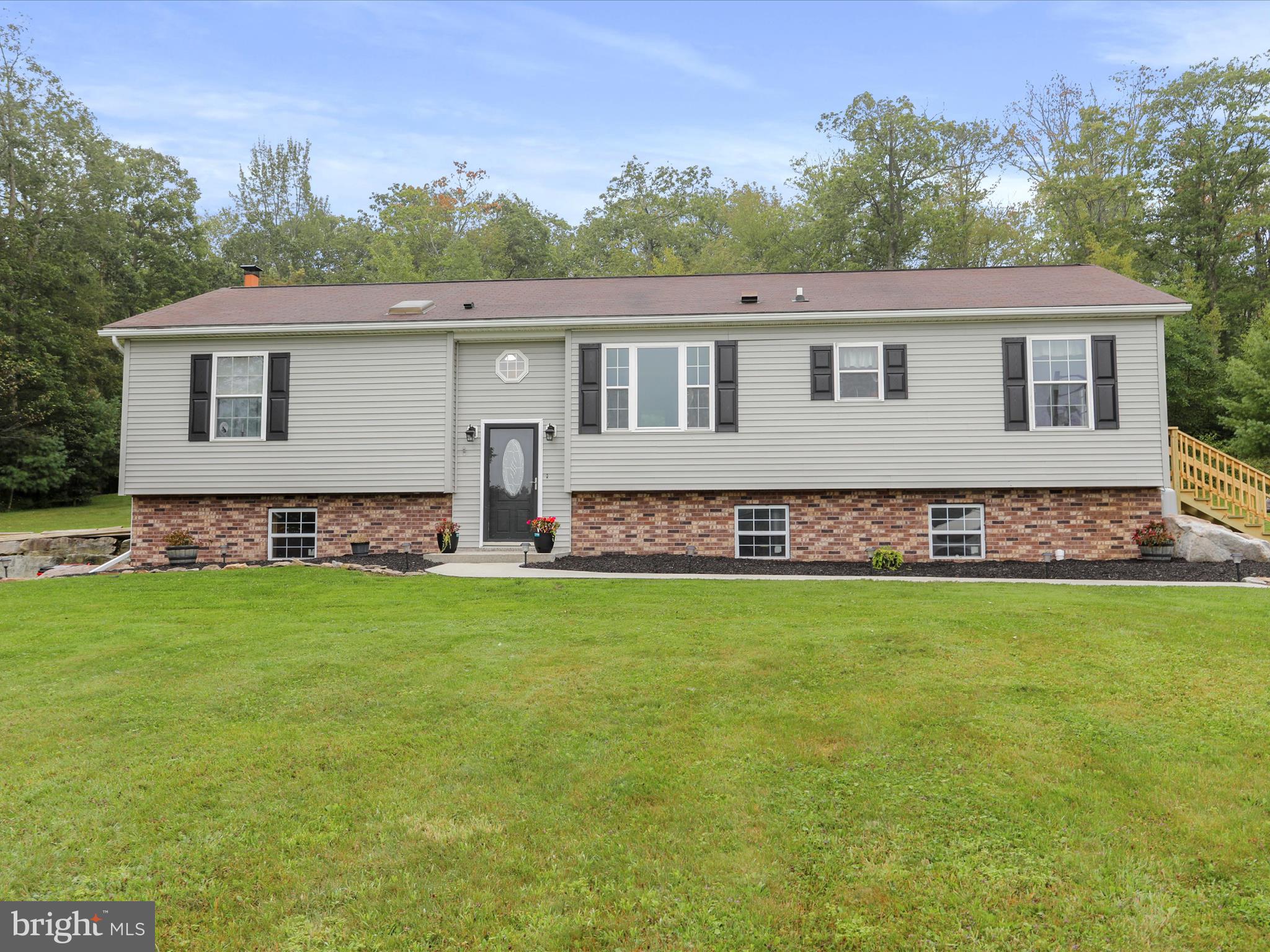 Convenience and quiet privacy can both be yours. Live right on a lightly travelled part of the historic National Pike, well maintained state road. Be in the town of Grantsville or on Interstate Rt. 68 in less than 5 minutes. At the same time, enjoy your own spacious 2.5+ acres, and/or wander the adjacent State Forest land. Enjoy the quiet home, well set back from the road, with a sprawling front yard and views of the neighboring farm and countryside. You can even take on a few chickens with the backyard coop.
Find easy living in this vinyl and brick sided home. Be ready to move in and enjoy, as it been mostly redone over the last 6 years. Sleep soundly with the primary bedroom and bath separated from the others. Relax in front of the stylish "Fireplace Wall". Feel secure in winter with both a well maintained furnace and a pellet stove that provides a backup source of heat. You might choose to bring the lower level fireplace back into operation too if you like. Use the entire lower level for tremendous storage or easily finish into additional living space.
Get prequalified with your lender so you can be ready to get in on the potential ownership of this attractive home in a very popular area.