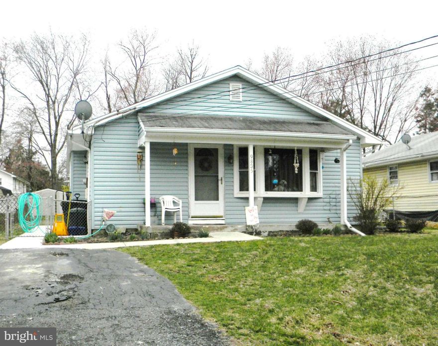 Home with lots of potential. Big tag items have already been replaced. New windows and roof in 2001.  Siding / Sound proof & insulated. Dishwasher & stove replaced in 2012.  The heating and air conditioner system recently replaced in 2014. Hardwood floors throughout. Nice size fenced  yard. Basement with room for possibly additional living space.  Home is sold "As Is",  Mostly needs cosmetics.