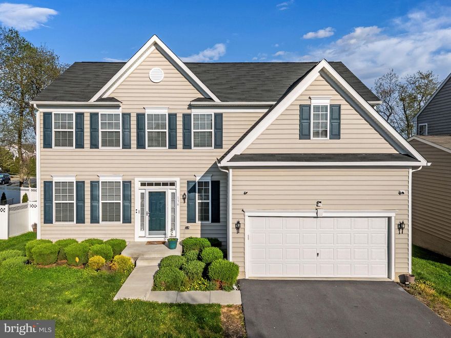 Built in 2020 and offering 3,408 finished square feet, this spacious 4-bedroom, 2.5-bath home blends modern comfort, thoughtful upgrades, and a highly convenient location. Still covered by its 10-year structural warranty, the home features 9-foot ceilings, an open layout, and a 5-foot rear bump-out that adds valuable living space beyond many similar models in the community.

The main level offers luxury vinyl plank flooring, formal living and dining rooms, a convenient half bath, and a generous family room that opens to the eat-in kitchen. The kitchen is well-appointed with stainless steel appliances, granite countertops, a large island, and plenty of space for gathering and everyday dining.

Upstairs, the primary suite includes a spacious sitting area, two walk-in closets, and a private bath with double vanity and walk-in shower. Three additional bedrooms, including one with a walk-in closet, a full hall bath, and an upper-level laundry area complete the second floor.

The partially finished basement provides flexible space for entertaining, recreation, or relaxing, and includes a home theater system plus rough-in plumbing for a future bath. Additional highlights include a water softener, 62-gallon hot water heater, built-in pest abatement system, existing security features, a 2-car front-entry attached garage with opener and interior access, and a fully fenced backyard with vinyl privacy fencing.

Set in a quiet community with everyday conveniences nearby, residents can enjoy a playground, walking trails, and a community pool coming soon, all with easy access to Route 9, shopping, and dining.