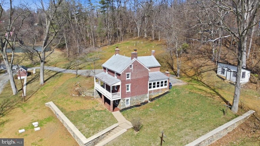 Completely remodeled all brick farmhouse on 3.5 acres with a pond.  The property also features a spring house, stone retaining walls and a detached building.  Sit on your front porch overlooking you're large front yard with a pond in sought after Myersville.  The home also has all new electric, plumbing, HVAC, well and septic system.  The inside is tastefully remodeled with a modern farmhouse style which includes 2 brick fireplaces, a completely new kitchen, 3 new bathrooms, new flooring throughout, new drywall and paint throughout.  Enjoy the privacy of 3.5 acres with the character of a farmhouse all with the modern conveniences of a new home.  Must see!!