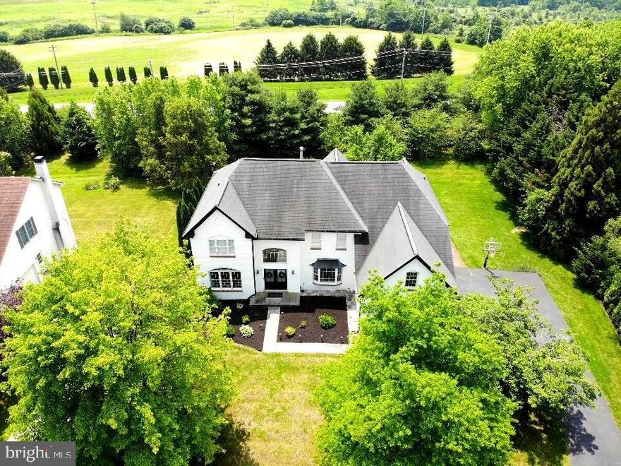 Update: NEW FRONT INTERIOR WINDOWS to be installed Aug 2025

Welcome to 8 Corbin, an exquisite custom home nestled in the highly sought-after Malvern Hunt. Set on open & lush grounds, this exceptional residence offers the perfect blend of traditional design, modern comfort, & a bright open view of natural surroundings. Located within the renowned Great-Valley School District, including K.D. Markley School, this 4/5/6 bedroom, 4 full, 1 half bath home is just 1 mile from Route 202 & 30 , offering easy access to all Philadelphia.

The home modernizes the Pennsylvanian colonial style with a striking, one-of-a-kind, white brick exterior combining traditional brick & Hardi siding (2022) complemented by a stylish dark gray roof, creating a show-stopping curb appeal effect. Step inside to a spacious, sunlit two-story foyer featuring gleaming light oak hardwood floors & custom trim work that create a bright, airy ambiance. The expansive foyer with sitting area leads into the formal living & dining rooms both adorned with wainscoting panels creating an elegant ambiance perfect for entertaining. A well-lit private office lets in natural light & can be used as a 5th guest bedroom with adjacent large custom closet for storage. 

The home’s pristine white kitchen with champagne bronze hardware is a true standout with a large island, high-end stainless steel appliances, double oven, gas range, custom cabinetry, & expansive pantry. The open layout enables an oversized dining table to be comfortably placed in the spacious dining area. The layout seamlessly flows from the kitchen to the dining area & into a spacious family room with expansive two-story ceilings & a convenient large natural gas fireplace, highlighted by a wall of windows that fill the space with views of the lush back yard. The adjacent siting bay area adorned with 180 degrees of natural light is a perfect seating area to relax & decompress. 

The sitting room offers easy access to the expansive wrap-around masonry stone patio with renovated sparkling flagstone staircases (2022). Custom outdoor lighting throughout the patio stairs, patio wall, & landscaping makes this house an eye-catcher in the evening, creating a perfect lighting ambiance for night-time gatherings. The patio overlooks the beautifully grounds & a sprawling lush backyard ideal for outdoor living. 

Upstairs, the luxurious owner’s suite is a true retreat, offering tray ceilings, recessed lighting, a bedroom-sized private sitting room, dual walk-in closets, & a spa-like en suite bathroom. The second-floor features three additional sun-filled bedrooms, two of which share one Jack-&-Jill bathroom. The fourth bedroom upstairs is oversized with a private bathroom. All bedrooms (& main rooms on the first/second floors) are modernized with high-tech canless LED recessed lights eliminating the need routine light bulb changes.

The home also includes a large laundry/mudroom area with plenty of storage solutions to accommodate frequent Costco runs. This area has access to 3 car attached garage with new garage doors & smooth running tracks. The garage floor is protected with an epoxy grade coating extending the indoor feel outside.

The fully finished basement provides a wealth of space, including a living room, kitchenette, dining room, full bath with walk-in shower), office, home gym, & recreation room that can also serve as a 6th bedroom to complete the full in-law suite. This massive lower level has a “main level” feel with its recessed lighting, high drywall ceilings (13-brick basement wall), & custom closets throughout. Ample Christmas decoration storage is easily accommodated within the three massive unfinished storage rooms. 

This white house presents a opportunity to own a one-of-kind-home in the Malvern area just a short ride to the train station, stellar public/private schools, & shopping in Malvern, King Of Prussia, & Main Line. Schedule a private showing today to experience all this home has to offer.