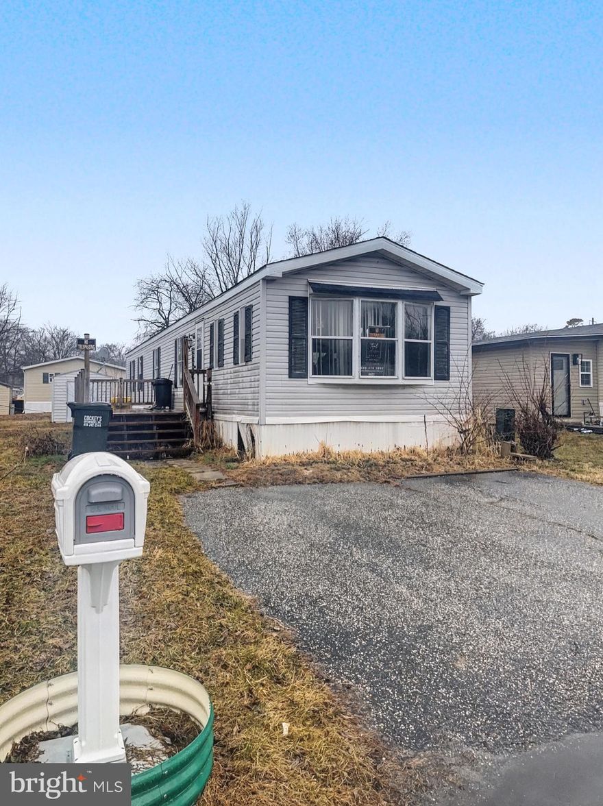 Bring your imagination and finish what the owner started! This 70’ x 14’ single-wide mobile home offers a great chance to create an affordable, comfortable space to call your own. Major systems are already done for you. The furnace, A/C, and hot water heater were replaced in 2020. The refrigerator, stove, dishwasher, washer, and dryer were all purchased within the last 5 years. A new roof was installed in 2025 and includes a warranty. Inside, LVP flooring has been partially installed, giving you a head start on updates. Outside, enjoy a shed with built-in shelving for extra storage. The monthly lot lease is $1,133, plus a $30.96 monthly trash fee. Park approval is required and includes a 600 minimum credit score, 10-year background check, and an application fee of $50 per responsible person and $30 for occupants age 18 and older. Two pets per household allowed.
