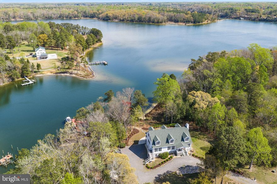 Completely remodeled home with 5 bedrooms and 5.5 baths on three levels overlooking Lowery Creek off the Corrotoman River!  With huge views and a dock to 8’ MLW, this property is perfect for boating/sailing enthusiasts, large families or those looking for a perfect STR. The versatile floor plan is well suited for a large family, multiple families or STR guests with a private third floor reserved for owners. The home can accommodate one level, open living on the main floor with a family room to include a gas fireplace, large dining area and waterside, gourmet kitchen to include two islands leading to a large waterside deck, waterside ensuite bedroom, two additional bedrooms, full hall bath and laundry room/half bath. The walk-out finished lower level offers addtional living space with wood stove, kitchen area, bunk room, full bath, waterside patio and oversized two car garage.  The upper level boast a large living room with wet bar, two waterside ensuite bedrooms and a laundry room.  With over 4 acres located outside of a flood zone, this property is rural, river living at its finest.