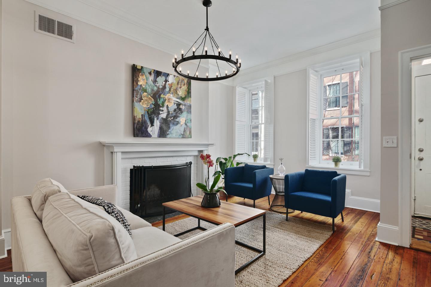 Welcome to 2120 Delancey Place! This 4 Bedroom townhouse in Rittenhouse Square is the perfect blend of original details and modern design situated on a quiet tree-lined street. Enter into charming vestibule with a single panel glass door. Through the vestibule is the spacious living room with original hardwood flooring, high ceilings and wood burning fireplace. The living room also features a custom closet - fully outfitted for hanging coats and storing everyday essentials. Open to the living room is the dining area with a built-in banquette. Past the dining area is the kitchen -- a high-end renovation featuring custom cabinetry with plenty of storage, granite countertops plus built-in seating for 6 people. The appliances will please the chef in the house -- a 36'' Wolf range with vent hood, built-in Sub Zero refrigerator, Miele dishwasher and Sharp microwave. Also off of the kitchen is a conveniently located powder room and glass sliding door that lead to the brick garden with space for a grill and access to the side easement to the street -- perfect for bikes, and bringing out the trash. The 2nd level has 3 spacious bedrooms, a full hall bathroom with tub, and the laundry closet. The 3rd floor is the newly renovated master bedroom suite. The bedroom is light filled and has built-in shelving, 2 closets that have been custom outfitted, plus a fully customized walk-in closet. The bathroom is stunning with 2 separate marble vanities, herringbone marble tile floors, a glass enclosed shower and separate soaking tub. Also in the master suite is a built-in home office with beautiful wooden desktop. Off of the 3rd floor is a private & serene roof deck with ample space for entertaining. The basement offers additional living space -- it is fully finished and complete with a powder room - perfect for use as a playroom, TV room, or home gym! 2120 Delancey Place also features new windows throughout, 2 zones of HVAC, plus a dream location with easy access to all the excitement of Rittenhouse Square, the recreation of the Schuylkill River Park, and the charm of the Fitler Square neighborhood.