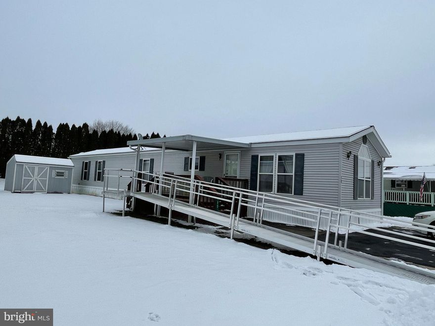 Nice sized rooms in this 2 bedroom, 2 bath manufactured home in a 55+ community. Master suite includes large
bedroom, W/I closet and large private bath with shower stall and garden soaking tub. Large kitchen with peninsula
and plenty of cabinets and counter space for your kitchen needs. There is a ramp for easy access and covered deck for
outdoor relaxation. Also a large shed and parking for 2 cars. Lot rent includes sewer and trash. All applicants must
be park approved. No pets are allowed.