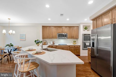 Photo of 104 Herndon Mills Cir, HERNDON, VA 20170 (MLS # VAFX2317132)