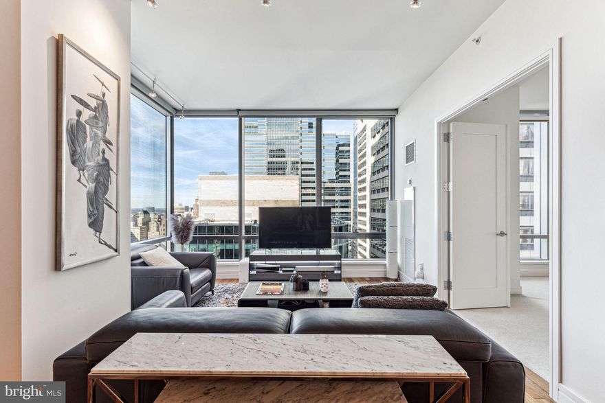 FIVE-STAR LUXURY LIVING AT THE RESIDENCES AT THE RITZ CARLTON – Soaring 34 stories above the city, this impeccable one bedroom, one and a half bath residence offers breathtaking panoramic views of the city skyline. The living and dining areas feature expansive ceiling heights, gleaming hardwood floors, and a wall of windows flooding the interior with light. The chef's kitchen boasts granite countertops, DORNBRACHT fixtures, and top-of-the-line VIKING, SUB-ZERO & MIELE appliances. The generously proportioned bedroom offers double door closets with organizers. The marble spa-like bathroom showcases double sinks with storage vanities, an oversized walk-in shower with a frameless glass door, and a large BAIN ULTRA soaking tub. Association fees include a 24/7 concierge, chauffeur-driven sedan, state-of-the-art fitness center, pool with a hot tub, and a residents' lounge with a media room and outdoor terrace. Perfectly situated in the Rittenhouse and Avenue of the Arts area, this deluxe pet-friendly residence is steps away from fine dining, unique shopping, world-renowned cultural destinations, and vibrant nightlife.