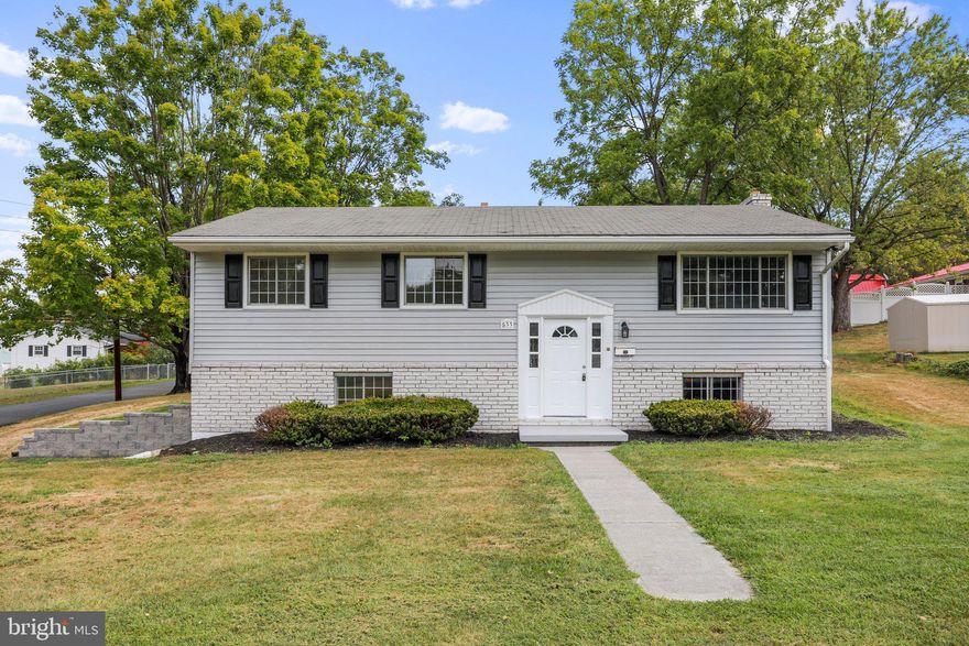 Take a look at this stunning split foyer home, nestled on a spacious corner lot in the highly sought-after Savillavale area of Romney, West Virginia. This meticulously remodeled residence is the epitome of modern comfort and style, with an ample 1,620 square feet plus a fully finished basement!
As you approach this home, you'll be greeted by its charming curb appeal. Situated on a corner lot, the property boasts an easily maintainable yard, allowing you to enjoy the beauty of the outdoors without the hassle of extensive & expensive upkeep.  Step inside, and you'll be awed by the transformation of this home. Every detail has been carefully considered and updated, resulting in a fresh and contemporary living space.  This home offers a generous four bedrooms and one and a half.  The beautifully updated countertops and kitchen space make meal preparation a pleasure, while the big open windows flood the interior with natural light.  The basement of this split foyer home is a true treasure. It features a charming brick fireplace wall with a woodstove insert, creating a cozy and inviting atmosphere for gatherings on those cool winter nights. The basement also includes a recreation/great room, providing extra space for entertainment and relaxation, as well as a convenient laundry area, half bath and fourth bedroom.
Step outside to discover an inviting outdoor patio, perfect for alfresco dining, barbecues, or simply unwinding in the fresh air. This space complements the home's indoor living areas, offering even more options for relaxation and enjoyment.  This beautiful split foyer home in Romney, West Virginia, is a rare find! With its extensive updates including a brand-new furnace, spacious layout, mountain town charm, and inviting basement with a wood-burning stove, it offers the perfect blend of style, comfort, and peace of mind! Don't miss the opportunity to make this home your own – schedule a tour today!