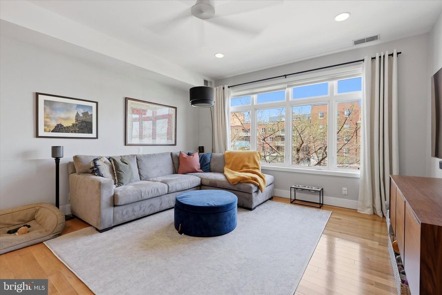 Welcome to 112 Market Street #3, a striking modern residence set in the heart of Old City Philadelphia—where history and lifestyle meet. Live among the same iconic streets once walked by Alexander Hamilton, Betsy Ross, and Benjamin Franklin, while enjoying the comfort and design of a contemporary home.

This 2-bedroom, 2 full and 1 half bath condo with private roof deck offers a truly unique layout that lives like a townhome—without the maintenance. From the moment you enter, the clean, modern design and open-concept layout set the tone. The main level features seamless living, dining, and kitchen spaces, centered around a stylish kitchen with sleek white cabinetry, grey granite countertops, stainless steel appliances, and a functional island—perfect for everyday living and entertaining alike.

Hardwood floors, recessed lighting, and oversized windows flood the home with natural light, creating a bright and inviting atmosphere throughout. Upstairs, both bedrooms are designed as en-suite retreats, each offering spacious layouts, well-appointed baths, and generous walk-in closets. The primary suite stands out with its spa-like bath featuring granite countertops and a glass-enclosed shower.

Step directly from the primary suite onto your private rooftop deck, where stunning skyline views create the perfect setting for morning coffee or evening relaxation. The dramatic sunset and nighttime city views elevate this space into a true highlight of the home.

Additional features include exceptional in-unit storage, a rare find in city living.
Situated just moments from Thomas Jefferson University and Pennsylvania Hospital, with easy access to public transportation and major highways, this location offers unmatched convenience. Enjoy a walkable lifestyle surrounded by world-class dining, shopping, galleries, and historic landmarks that make Old City one of Philadelphia’s most sought-after neighborhoods.

A rare opportunity to own a sophisticated, low-maintenance home in one of the city’s most iconic locations.