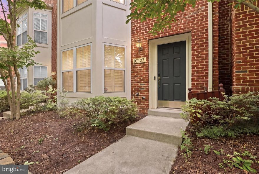 Welcome home! This beautifully maintained brick townhome is ideally situated in the heart of Columbia, featuring a rear-entry two-car garage and offering the perfect blend of quality, convenience, and comfortable living. Enjoy unmatched accessibility with shopping, dining, entertainment, and fitness centers all within a 5–10 minute walk. Step into the first level and be greeted by a warm and inviting entryway. A private and quiet home office immediately catches your eye, complete with engineered hardwood flooring and an elegant bay window that enhances both natural light and architectural appeal. This level also includes a laundry room and garage access, delivering a practical and efficient layout. Upstairs, the bright and expansive main living area showcases an open and airy design. Engineered hardwood floors flow seamlessly through the living room, dining area, and family room, creating a cohesive and welcoming atmosphere. The living room features a charming bay window that fills the space with sunlight, while the family room offers a cozy gas fireplace and opens effortlessly to the kitchen and breakfast area—perfect for everyday living and entertaining. The kitchen strikes the perfect balance between style and functionality, boasting granite countertops, a spacious island with a breakfast bar, and a pantry. It is equipped with high-quality stainless steel appliances, including a refrigerator with ice and water dispenser, dishwasher, built-in microwave, and gas range/oven. Large windows flood the entire level with natural light, creating a bright and vibrant living environment. A well-appointed half bath completes this floor. The third level offers a peaceful and comfortable retreat. The spacious primary suite features two walk-in closets—one with custom built-ins—along with a vaulted ceiling and ceiling fan for added comfort. The en-suite bathroom delivers a spa-like experience, complete with a large jetted soaking tub, dual vanities, and a separate shower. Two additional bright bedrooms and a full bathroom complete the upper level, providing flexibility for a variety of living needs.
2 Units HVAC replaced on 2023， Water  Heater replaced on 2024，Washer/Dryer and Refrigerator replaced on 2025,, Dishwasher replaced on 2020. Don't miss it.
