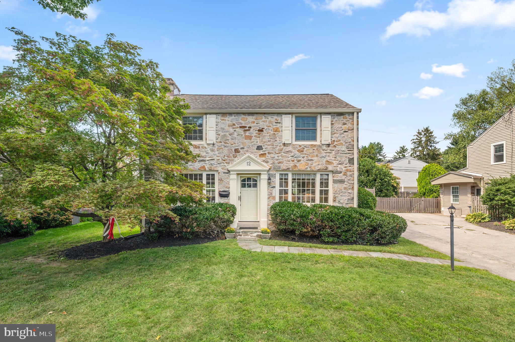 Welcome to 12 Lowrys Lane, a gem nestled in the prized Old Oaks neighborhood of Radnor Township. Out of a storybook, this beloved community is known for its family-friendly charm, tree-lined streets, and sidewalks where neighbors stroll, children play, and friendships are easily made. From the moment you arrive, the welcoming curb appeal sets the tone for a truly special property. Upon entering the Foyer, the sunny disposition of this home can be felt as gleaming hardwood floors, connect one with the Living and Dining Rooms flanking each side. The oversized Living Room, anchored by a fireplace, is bathed in natural light and offers direct access to a covered patio, seamlessly connecting the indoors to an "outdoor room” perfect for year-round entertaining and relaxation, while the Dining Room is designed to host everything from formal gatherings to intimate family dinners. The bright and cheery Kitchen is a delight, featuring crisp white cabinetry, stainless steel appliances, and generous granite counter space. Flowing naturally into the Breakfast Area, this family-friendly hub is enhanced by a custom banquette and a wall of custom cabinetry that not only adds storage but creates the perfect spot to enjoy meals together, catch up on homework, or watch TV in comfort. Off of the Kitchen is a convenient Laundry Room and desk area, adding everyday practicality to the home’s thoughtful design, and the First Floor is completed by a Powder Room for added convenience. Upstairs, the private Primary Suite offers a serene retreat with an updated Ensuite Bath, and in addition there are two more generously sized Bedrooms and another Full Bathroom, a rare find of a house this size in the Old Oaks neighborhood adding both flexibility and appeal for today’s buyers. The Lower Level is currently unfinished but freshly painted and ready to be transformed, with its open and large footprint offering endless opportunities to create the recreation space, gym, media room, or additional living areas you’ve always envisioned. Outdoors, the property shines with a lovely backyard oasis, where the covered patio acts as an extension of the home and fence frames a private retreat, perfect for barbecues, gardening, or simply enjoying the peaceful setting. Located in one of Radnor Township’s most desirable neighborhoods, Old Oaks, this home offers a warm sense of community, award-winning Radnor schools, walk to dining in Bryn Mawr and 2 Playground Parks, close proximity to Wayne, and train access to Center City Philadelphia. 12 Lowrys Lane is more than a home—it’s a lifestyle, promising years of cherished memories in one of the Main Line’s most family-friendly and charming enclaves. ALL SHOWINGS BEGIN ON THURSDAY SEPTEMBER 4th!!