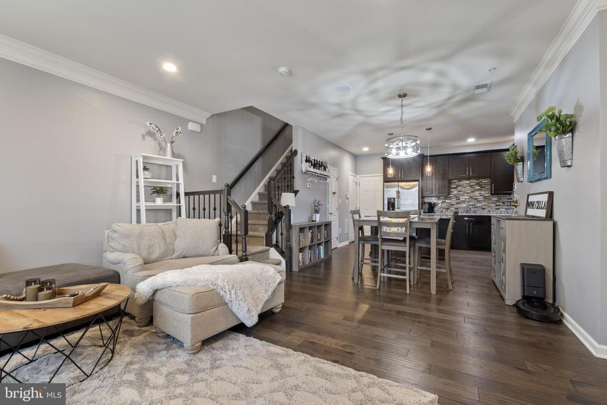 Welcome to this designer-inspired dream home where no detail was overlooked!! This stunning, model-like end unit is packed with thoughtful upgrades and stylish touches from top to bottom.  

Step into the gourmet kitchen, featuring sleek stainless steel appliances, one-of-a-kind gorgeous granite countertops, a chic designer backsplash, and upgraded cabinetry with elegant glass fronts. Custom light fixtures—carefully selected to complement every room—add just the right pop of pizzaz and will convey with the home.

The open staircase boasts a plush designer carpet runner and contemporary iron balusters, setting the tone for the modern elegance that flows throughout the space.  

Upstairs, the glamorous primary suite is a true retreat—complete with a tray ceiling, serene color palette, private deck for morning coffee or a good book, a spacious walk-in closet with a cozy sitting area, and a spa-like en suite bath. Enjoy dual vanities, a private water closet, oversized shower, and a linen closet tucked behind a charming single glass front French door.

Two additional bedrooms, a full bath, and a laundry closet with custom cabinetry round out the upper level. As a sun-kissed end unit, this home offers added privacy and an open, grassy space out front—perfect for enjoying the outdoors.

Living here means more than just a beautiful home—it’s a lifestyle. Enjoy the added convenience of a vibrant community featuring top-tier amenities like basketball and tennis courts, scenic bike and jogging trails, a sparkling outdoor pool, picnic areas, and tot lots for playtime fun. Stay active and connected with access to a full fitness center, exercise room, clubhouse, party room, and a welcoming community center surrounded by well-maintained common grounds.

**ASK US ABOUT OUR VA ASSUMABLE LOAN!**