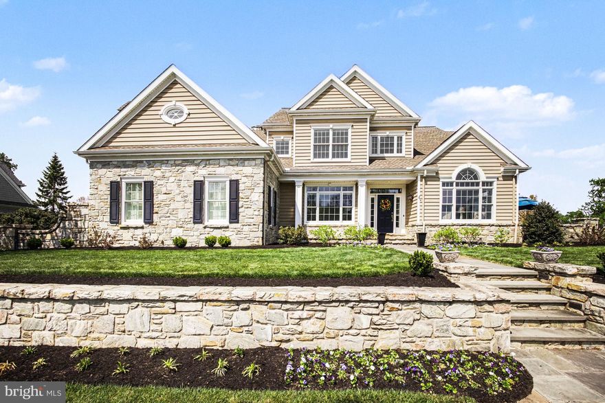 Thoughtfully reimagined by its current owner, nearly half-acre homesite within the prestigious Bent Creek Country Club community, this exceptional residence blends timeless architecture with extensive modern upgrades. With captivating curb appeal and thoughtfully enhanced interiors, this home delivers both presence and performance.Step inside to a striking two-story foyer highlighted by a completely rebuilt grand staircase featuring new treads, risers, balusters, and handrails—setting the tone for the craftsmanship found throughout. The open-concept layout is filled with natural light, enhanced by new lighting fixtures, oversized interior doors, and updated baseboards that create a clean, cohesive aesthetic across the entire home.The heart of the home is the beautifully updated gourmet kitchen, where painted cabinetry is complemented by new granite and quartz countertops, double ovens, and a new dishwasher. A custom cabinetry room divider with integrated shelving seamlessly connects the kitchen to the family room, offering both function and architectural interest.The family room has been reimagined with a stunning custom masonry wood-burning fireplace and built-in entertainment system—creating a warm and inviting space for gathering. Just off the main living area, the fully renovated home office features hickory hardwood flooring and custom built-ins, providing a refined and productive workspace.Upstairs, the completely remodeled primary suite offers a private retreat with its own dedicated HVAC system, a new gas fireplace, and a fully redesigned luxury bath. Custom-built closets, an additional closet addition, and new doors elevate both function and style. Additional bedrooms remain spacious with walk-in closets, including a well-appointed ensuite and shared bath configuration.The finished lower level has been refreshed in October 2025 with new carpeting, lighting, paint, and a drop ceiling—offering expansive space for recreation, fitness, or entertaining.Outside, two flagstone patios provide multiple outdoor living options—whether enjoying peaceful garden privacy or overlooking the scenic golf course setting.Additional major improvements include a new natural gas line to the home and upgraded attic insulation with blown-in cellulose for enhanced efficiency and comfort.Located just steps from the amenities of Bent Creek Country Club—including golf, tennis, fitness, dining, and pool options (membership optional)—this home offers not just a residence, but a lifestyle within one of Lancaster County’s most sought-after gated communities