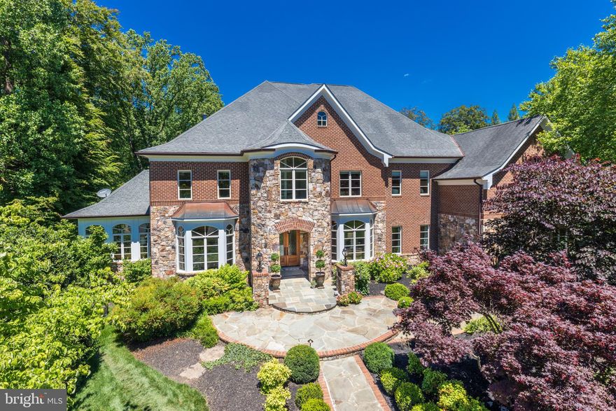 9,350 SF!  This stunning estate home is handsomely sited on a lushly landscaped acre at the end of a cul de sac.  One of the few homes built in The Reserve by custom builder Adrian Edwards . The inspiring beauty starts at the curb, carries through the grand floor plan and into tranquil outdoor living spaces. An entertainer’s delight, one can easily host over 150 people for both formal and informal gatherings.  The center hall is anchored by the compass rose marble inlay, from which the home's formal rooms radiate. Each room is finely curated with crown and picture molding . The main level is designed for entertaining with spacious formal living and dining rooms.  Adjacent to the living room is a light-filled and airy conservatory, perfect for listening or playing music or just escaping to nature. Through the foyer towards the back of the house is a private mahogany library/executive office perfect for running your business or cozying up with your favorite book. The extensive built-in shelves can house your book collection. The main level continues with a family room complete with soaring ceilings, stone fireplace, views of the woods and opens to an oversized, gourmet kitchen. The open kitchen is connected to the screened in porch, a tranquil spot any time of day.  Enjoy the soothing sounds of nature and the new fountain feature.  The gourmet kitchen is well equipped with the stainless-steel double oven, two dishwashers, multiple meal prep stations and a pantry. The large center island has seating and ample extra storage.  There is also a work-station in the kitchen to use as your command central and a second staircase leading the upper level for quick access. Off of the hallway is a main-level ensuite bedroom, laundry room, pantry, mud room and access to the three-car garage. The upper level features 5 generous sized, en suite bedrooms with walk-in closets. The master suite is elevated from the rest of the bedrooms, providing privacy and sweeping natural views. It is a lovely retreat, complete with a sitting room/private office, double-sided fireplace and private storage. The luxurious master bathroom has separate vanities, shower and bath.  The walk-in closet is a masterpiece!  Further down the hall there is a bonus built in study area, equipped for two with built-in desks, bookshelves and storage perfect for multiple students. Also here is a 2nd laundry room with a brand-new sink and washer (2019)/dryer (2021).  At the end of the hallway is the pinnacle of the second floor: an expansive natural light drenched artist studio, which could also be used as a private office, playroom or au pair suite.   Entertainment options abound in the lower level, boasting 10.5ft ceilings with a recreation area perfect for media, hosting or playing ping pong and pool. Walk-out through French doors to the patio, enjoy the fire pit and bubbling water feature in the backyard. The 7th bedroom is currently being used as a pool room and bar, but has previously served as bedroom with the adjoining bathroom and closet. This level also features approximately 1000 sq ft of essential storage. The home is surrounded by the privacy of nature and boasts exquisite landscaping and stonework. This home exterior is completely maintenance free. Weather Shield windows and doors.  All the trim is Timbertek AzEK which requires no maintenance.  ***ADDITIONAL CONVEYANCES:  Pool table   Tesla/electric charger   Green hutch in kitchen (if desired)