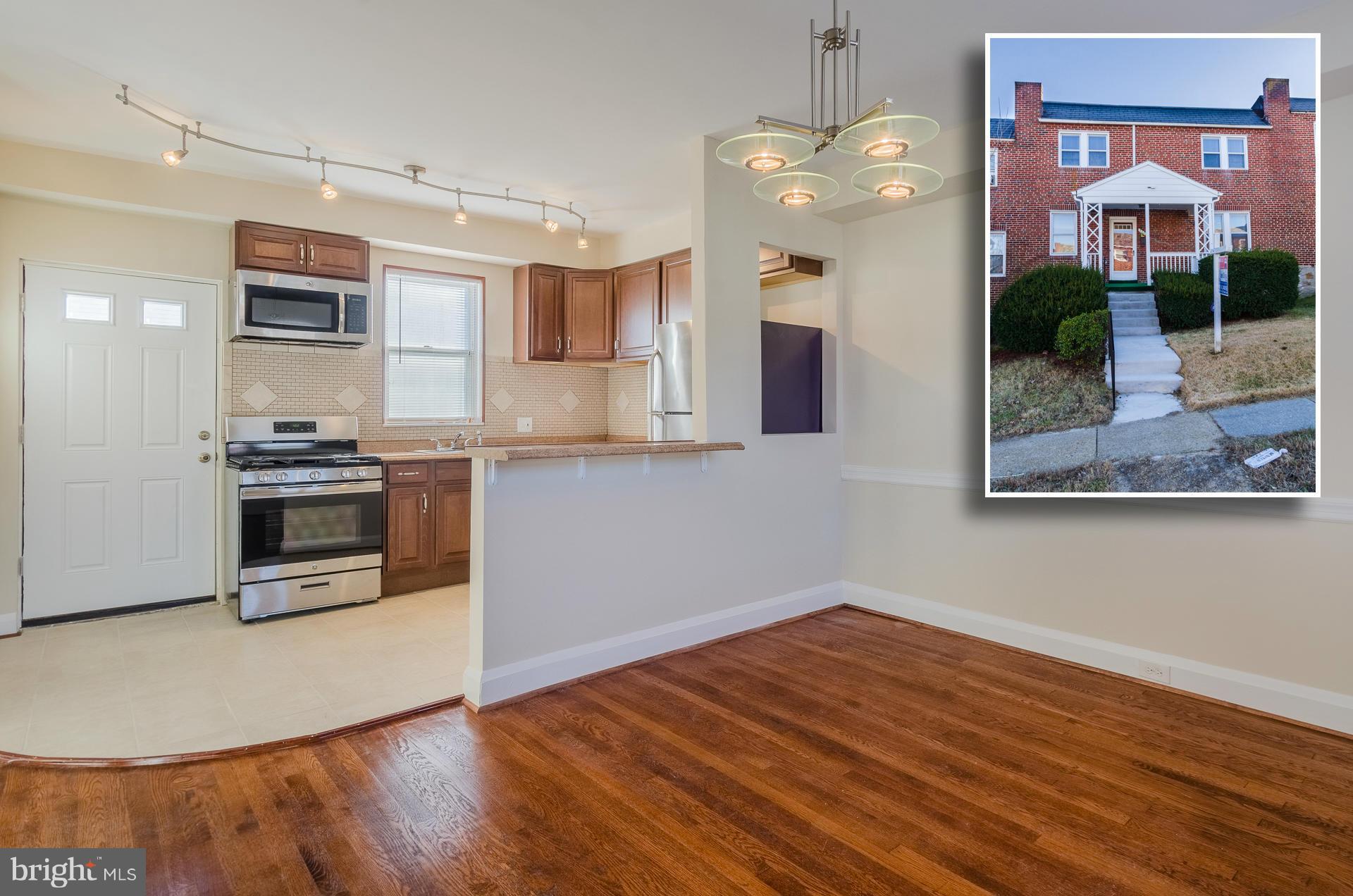 EXTRAORDINARY RENOVATION WITH 3 FINISHED LEVELS & LARGE REAR YARD! Hw floors throughout, spacious living room, separate dining room w/ chair rail, Chef's kit w/ granite counters, ss appliances, & tile backsplash, main level half bath, upper level w/ 3 bedrooms & 1 full bath, finished basement w/ family room, half bath, & laundry room, and large rear fenced yard. Move right in!