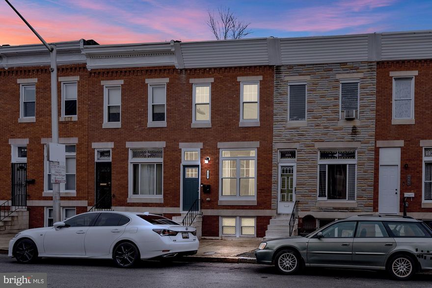 Welcome to 2227 Cecil Ave — a fully renovated 3-bedroom, 2-bath brick rowhome (  1,764 sq ft) in the heart of East Baltimore‑Midway. The main level features restored hardwood floors, exposed brick accents, recessed lighting, open-flow living and dining areas, and a modern kitchen with soft-close wood cabinetry, granite countertops, stainless-steel appliances, stylish backsplash, and pantry storage. A full bath on this level adds convenience. Upstairs are three well-sized bedrooms, including a primary bedroom with generous closet space, and a second full bath finished with quality tilework. The partially finished basement offers additional living or storage space — ideal for a recreation room or home office. Outside you’ll find a fenced grassy yard and a concrete patio, perfect for outdoor gatherings or relaxation. The home includes forced-air heating and central A/C, and sits on a quiet residential block. Residents benefit from proximity to local amenities: the neighborhood is part of East Baltimore-Midway, known for its mix of renovated rowhomes and easy access to nearby parks, cultural institutions and major institutions. Within minutes you are close to Johns Hopkins University, Clifton Park / Clifton Park Golf Course, and The Baltimore Museum of Art — offering green space, recreation, arts and culture just a short distance from your door. This home combines historic charm with modern upgrades, providing a move-in ready opportunity in a neighborhood with access to schools, transit, and city amenities.