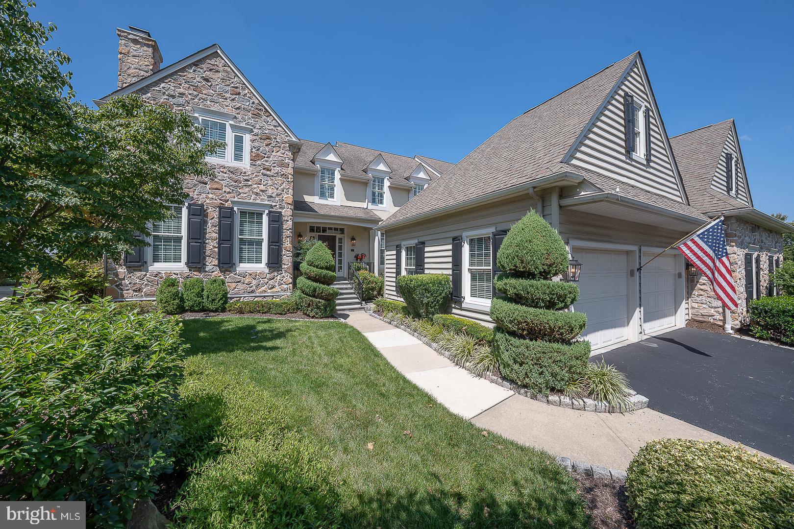 Discover unparalleled sophistication in one of a kind, exceptional 3-bedroom, 3.5-bath carriage home, ideally situated on the 17th green of the prestigious Applebrook Golf Club in East Goshen Township. Originally designed by and for the builder (Pohlig) himself, this custom residence is located in the highly sought-after Applebrook community and features the highest-quality materials, superior craftsmanship, and an elevated trim package throughout. Approach this inviting home through a private, beautifully landscaped entrance featuring a charming front door and a peaceful side landing with a bench. From the moment you step into the grand foyer, you'll be captivated by the gleaming hardwood floors, intricate crown molding, and sweeping staircase that set the tone for timeless elegance. The formal living room impresses with a striking gas fireplace framed by floor-to-ceiling millwork, while a private study with custom built-ins and recessed lighting offers a refined space to work from home or read. A stylish formal powder room and coat closet for guests sits conveniently as you enter the main living areas. Designed for both luxurious daily living and exceptional entertaining, the sun-filled family room boasts a coffered ceiling, surround sound system, gas fireplace, hidden storage within custom cabinetry, and a wall of French doors that frame breathtaking views of the golf course. The chef’s kitchen is a showpiece, equipped with a 6-burner gas cooktop, double ovens, granite countertops, paneled Sub-Zero refrigerator, oversized island, and built-in secretary’s desk. A bright and airy breakfast room provides panoramic views, while the formal dining room dazzles with refined millwork. The adjoining bar area is equipped with glass cabinets and a wine fridge for effortless entertaining. A spacious mudroom off the two-car garage completes the main level with functionality and style. Upstairs, the elegant primary suite offers a tranquil retreat, featuring tray ceilings, dual walk-in closets, and a spa-inspired ensuite with soaking tub, oversized tile shower, heated floors and dual vanities. Two additional bedrooms with generous closet space share a Jack-and-Jill bath with separate vanities, glass enclosed shower and a skylight, while a large laundry room and an additional office or optional fourth bedroom with gas fireplace offer versatility for modern living. The fully finished lower level extends the home’s exceptional living space and is thoughtfully designed for both relaxation and entertaining. It features a full wet bar complete with an ice maker and beverage center, a custom wine cellar, and a comfortable lounge area perfect for movie nights or casual gatherings. A spacious recreation area with a pool table, a full bath, sauna, and a home gym, easily adaptable as additional office space, adds to the versatility of the space. Ample storage is also available throughout, ensuring both form and function are effortlessly maintained. Step outside to a beautifully landscaped flagstone terrace, featuring a pergola, built-in gas grill, stone fire pit and surrounding wall, and retractable awning perfect for year-round entertaining or simply enjoying the serenity of the golf course and captivating sunsets. This sun-drenched, custom-designed home also includes a full home generator, ensuring uninterrupted comfort and security no matter the weather. Ideally located just minutes from the shops and dining of Malvern, East Goshen Park, Willisbrook Preserve, and Philadelphia’s Main Line, 337 Applebrook Drive offers the pinnacle of luxury living in an unmatched location. This sun-drenched, custom-designed home is an extraordinary opportunity not to be missed.