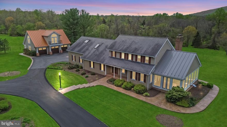 This beautiful Southern Frederick County estate sits on 29.7 acres of land and offers stunning views of Sugarloaf Mountain! The property is located on the border of Thurston and Sugarloaf Mountain Roads and features two spring-fed streams and a stocked pond. Access to the Sugarloaf Trails is also easy from this location, making it an excellent option for outdoor enthusiasts.  The home has been thoughtfully updated and includes 4 bedrooms, 5 ½ baths, and a wide array of modern upgrades. 

Inside, you’ll find recently upgraded bathrooms with elegant Toto toilets and recently replaced sink faucets. Enjoy a recently added Starlink internet connection for fast, reliable service. The recently replaced Andersen and Marvin windows, Western Red Cedar ceilings, and extensive recessed/track LED lighting are just a few of the features that make this home truly unique. The property also boasts 6-zone heating and 3-zone cooling, geothermal heating/cooling with optional gas heat, and a condensing gas boiler. The updated kitchen includes granite counters and cherry cabinets. A glass porch with flat panel baseboard heating, a second-floor bedroom suite, and a sunroom with an in-floor 350-gallon spa are just a few more features that add to the home's appeal. The property also includes a 2 ½ car heated and cooled garage, a new 20KW whole house LP gas generator, and 1,000 and 500-gallon inter-connected LPG storage tanks. Recent updates also include an updated well pump and electronic subdrive. Hardie Shingle Siding and extensive Arizona Slate walkways complete the exterior of the home. In addition to the main house, there is a 3-bay garage-accessory structure with 800 SF of unfinished living space that features a recently added standing metal seam roof. This structure also has electric and water connections to the main house. Currently, the property is taxed under the Maryland Agricultural Use Program. Overall, this is a stunning property with a beautiful home and extensive outdoor amenities.