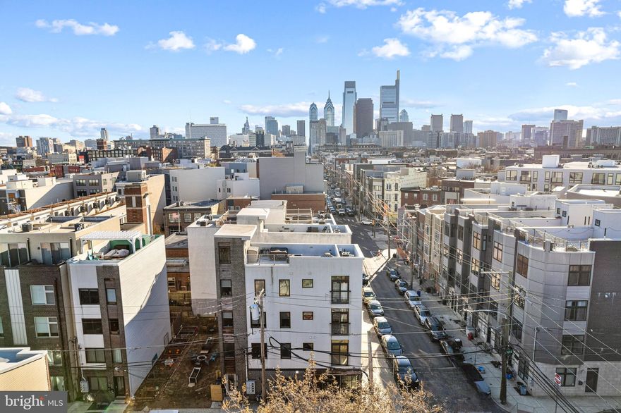 Available for May move in, this incredible condominium is a rare find for a rental. Situated on the full top two floors of a quiet building, this bi-level unit offers over 1,200 square feet of living space with 2 bedrooms, 1 and 1/2 baths, and its own private roof deck with incredible skyline views. Enter into the first level to find open concept living and dining. Chef's kitchen features a full suite of stainless steel appliances including built-in microwave and dishwasher and gas cooking. A convenient powder room and storage closet completes this level. Take the sunsplashed open stairs up the the second living level to find the first bedroom, perfect for a home office or guest bedroom suite, upper floor laundry, and a spa-like full bath with sliding glass enclosed shower. The primary bedroom suite has large windows and excellent closet space. Upstairs is your own private roofdeck, with no nearby neighbors, offering incredible skyline views and ample room for outdoor furniture and grilling in the warmer months. All hardwood floors throughout entire unit, central air, and custom window treatments complete this fantastic unit. Separate dedicated storage unit in the building offers additional space. Located above Vineyard's cafe, your morning coffee is just downstairs. Walk to all the Fairmount and Art Museum areas from this Francisville location, or find the Broad Street Subway line just 3 blocks away for a quick commute downtown or to the stadiums to catch a game. Downstairs outside the building is a community garden that is lovingly maintained and enjoyed by the neighbors. Pet friendly at landlord's discretion with pet fee or deposit based on type/weight. Available for anytime in May move in.