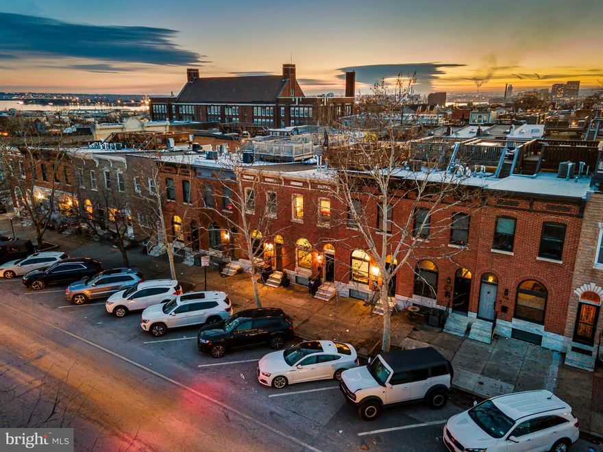 Welcome to 724 S Conkling Street, a rare 13.5-foot-wide rowhome offering over 2,300 square feet of living space on a beautifully tree-lined, café-lit block in an ideal Canton/Brewer’s Hill location. Featuring 3 bedrooms, 3 full bathrooms, a second living area in the finished lower level, and a rooftop deck with stunning skyline and water views, this home truly checks all the boxes.

The main level offers warm hardwood floors, abundant natural light, and an open layout that flows into an oversized kitchen with a large island, plentiful cabinetry, and a custom backsplash that adds personality. Upstairs you’ll find two spacious bedrooms and well-appointed baths, while the finished lower level provides valuable flex space for a second living room, guest area, gym, or office, along with a third bedroom and full bath.

Out back, the oversized parking pad easily fits a large SUV or can be used for a car plus a grilling and entertaining area. Ideally located near Canton Square, Brewers Hill restaurants and coffee shops, Canton Crossing, Canton Waterfront Park, Patterson Park, and major commuter routes, offering the perfect blend of space, style, and convenience.