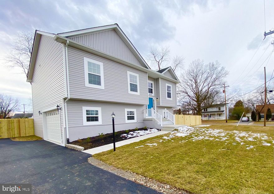 Custom built 2021 New Construction. Very close to the Fairfax County Line and I-66. Beautifully designed home located on large leveled corner lot. No HOA. Featuring 5 bedrooms, 3 full baths, 1 half bath, 2649 finished square feet. 9 foot ceilings throughout the entire house. Low E & Argon gas windows for reduced energy costs, with custom trim over all the windows. Upper level features gourmet kitchen w/ custom 42 inch premium solid wood cabinets, slow close doors and drawers, custom crown molding around all cabinets, solid quartz countertops, stainless steel appliances, large island, breakfast area. 38 recessed LED lights throughout the entire house. Premium luxury vinyl plank flooring that is water proof and scratch resistant on entire main level, crown molding and trim work surrounding all kitchen and living areas. Master Bedroom features tray ceiling with double crown molding, huge walk in closet, meticulously tiled master bathroom, soaking tub, designer shower, double vanity with granite counter tops. Two more bedrooms upstairs and a custom tiled full bathroom w/granite vanity counter. Lower Level features striking tile throughout recreation room/area and 1 full bathroom along with two more bedrooms, multiple storage closets, and a utility room. Two laundry rooms, one on each floor - Washer/Dryer included. Oversized 2 car garage door featuring a quiet belt drive system, glass inserts and a plus sized 8 foot door. 30 year architectural shingles for the roof and seamless gutters surrounding the entire house. Custom 6 foot fencing around entire house with two double doors for entry on both sides of the yard Builder enhanced the home with many more quality details all throughout this beauty. Floor plans available for review.