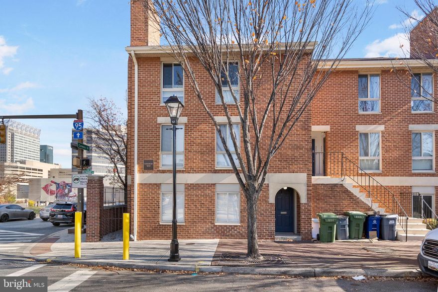 Welcome to this stunning renovated condo in Baltimore’s sought-after Otterbein neighborhood.  Enjoy the best of downtown living in the beautifully renovated ground-level 2 bed, 2 bath end unit with a bright and open floor plan. The living room, dining area and hallway all feature luxury vinyl plank flooring and clear sight lines that create a warm, inviting flow. A cozy wood-burning fireplace adds charm to the spacious living room. The brand new gourmet kitchen is a showstopper- completely renovated with sleek s/s appliances, quartz countertops, tile flooring, and a gorgeous waterfall island. The dining room features a designer black and gold accent wall, bringing modern, stylish touch to the home. Both bedrooms are generously sized with large windows that fill the space with natural light, they also have vinyl plank flooring, and floating console tables that give it that modern feel. Both bathrooms have been  remodeled with a black and white contemporary theme.  Assigned, gated parking conveys—rare and convenient for city living. Unbeatable location just a short walk to the Inner Harbor, MARC train, UMD, Downtown, Federal Hill, M&T Bank Stadium, Camden Yards, all major highways and countless shops and restaurants. Enjoy low‑maintenance living in the heart of Baltimore with everything you love right outside your door. Seller is a licensed realtor. Seller is willing to sell furnishings separately or include them with the purchase if desired. Hurry this one won't last long.
