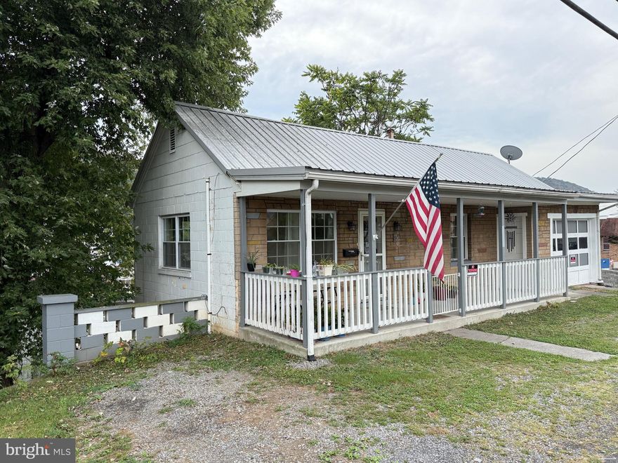 ATTRACTIVE (SPICK-AND-SPAN) 3 BEDROOM, 1 BATH BUNGALOW W/STONE FRONT EXTERIOR, COVERED FRONT PORCH, METAL ROOF, ATTACHED GARAGE AND OFF-STREET PARKING.  MAIN FLOOR: LIVING ROOM WITH HARDWOOD, T&G WALLS, NEW CEILING FAN/LIGHT & (2) DOUBLE HUNG WINDOWS.  BEDROOM W DRYWALL, LAMINATED FLOORING & NEW CEILING/FAN LIGHT. STAIR TO ATTIC.  THE LOWER-LEVEL FEATURES KITCHEN WITH OAK CABINETS, APPLIANCES (OVEN/RANGE, REFRIGERATOR – 3 YRS OLD), DISHWASHER, VINYL FLOORING AND DINING AREA W NEW FAN/LIGHT.  2 BEDROOMS WITH WOOD PANEL WALLS AND COMMERCIAL CARPETING. UPDATED BATHROOM W/VANITY, MEDICINE CABINET, LIGHTING (3 YEARS OLD) AND BRAND NEW TUB W LINER WALLS. LAUNDRY ROOM WITH WASHER/DRYER HOOK-UP AND ACCESS TO OUTSIDE.  NEW REPLACEMENT WINDOWS, ELECTRIC HOT-WATER HEAT, CITY WATER AND SEWER, 40 GAL HOT-WATER TANK AND PRICED TO SELL!!