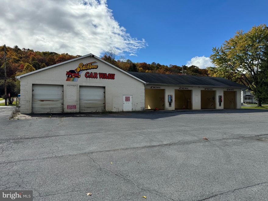 Loads of possibilities for this former carwash property. There is a large paved parking lot and solid 3,700 sqft block building with 6 bays. Perfect for your business or storage needs. This property won't last long call today to schedule a showing. 

There will be a deed restriction that the property cannot be used as a carwash.