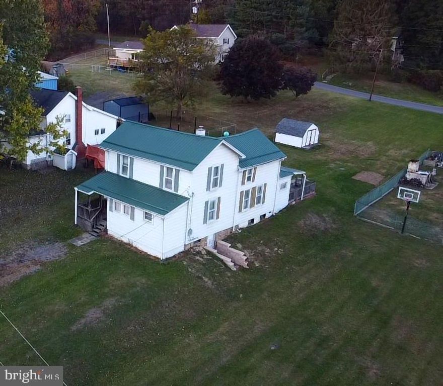 Discover the potential of this spacious farmhouse nestled in the quiet community of Carlos just minutes away from Frostburg State University and downtown Frostburg.  This home offers two inviting living rooms, a large kitchen perfect for family gatherings, a full bathroom and a convenient mud room/entry way on the main level.  Upstairs you will find 2-3 generous sized bedrooms, providing flexible space for your needs.  There is a full basement for extra storage. Enjoy the evenings on the rear deck overlooking a large yard ideal for gardening, entertaining, or simply relaxing.  This home is ready for your personal upgrades and modern touches to make it truly your own. Did I mention it comes fully furnished!!