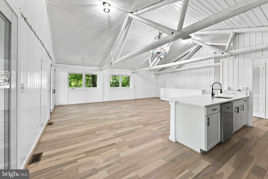 Welcome to this spacious and well-maintained waterfront home located on a quiet cul-de-sac in the desirable Chesapeake Ranch Estates community.

This property offers over 2,200 square feet of finished living space, featuring a bright main level with an open layout and large windows. The kitchen flows directly into the dining and living areas, making it ideal for both daily life and entertaining. The home also includes a finished basement that provides versatile space for a family room, office, or guest area and two full bathrooms.  

Key features of the property include:

- Waterfront Living: Situated on a large, wooded lot with rear steps leading from the backyard directly to a private, shared sandy beach.
- Community Amenities: Access to private beaches, a lake, a community center, and playgrounds.
- Recent Upgrades: Brand new 3,500-gallon holding tanks have been installed (drive-over rated).

Located with convenient access to local shops, schools, and major routes, this home offers a perfect blend of privacy and community