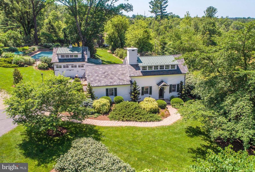 Tucked amid glorious gardens and timeless stonework, Apple Tree House is a cherished historic residence dating to the late 1700s—a place where centuries-old charm and modern sophistication are artfully entwined.

From the moment you arrive, the setting enchants: sweeping views, curated landscapes, and the soothing sounds of a bluestone fountain create an atmosphere of complete serenity. Inside, the main residence offers two spacious en-suites, including a tranquil first-floor primary suite, ideal for effortless living. Each room is layered with warmth—original wood flooring, deep-silled windows, and thoughtful architectural details that whisper of the home’s rich heritage.

The gourmet kitchen serves as the heart of the home, flowing seamlessly into the inviting family and living room with scenic views. These spaces are bathed in natural light and offer gracious access to the stone laid terrace, where indoor-outdoor living takes center stage.

Beyond the main house, a beautifully renovated carriage house offering exceptional flexibility, featuring a full bath, enclosed sitting area, and private bedroom—perfect for guests, extended stays, or creative use or home office.

A sparkling 20x40 pool with spa anchors the grounds, stunning views, surrounded by curated gardens, stone terraces, and secluded nooks for dining or reflection. Whether enjoyed as a weekend escape or a year-round haven, Apple Tree House is a rare opportunity to own a piece of Bucks County living in a unique setting of enduring beauty, conveniently located near all!