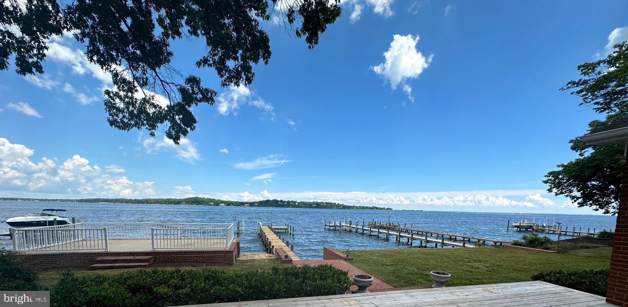 Unparalleled Views of the Magothy River and Chesapeake Bay, watch ships coming and going while enjoying all the waterfront activities this property has to offer, this gorgeous property offer 1.23 acre lot, with all brick 4 bedroom 3 bath home with expansive water views as soon as you walk through the front door, wide open floor plan, high ceilings, hardwood floors, Cherry cabinets, S/S appliances, separate refrigerator & freezer, Granite countertops, main level laundry, upstairs features a private primary suite w/raised platform to enjoy the sunrise from bed, super bath including double vanities, separate shower and jetted tub overlooking the water, the primary suite offers a sitting area and walk in closets, there is a large deck and an expansive raised patio overlooking the water w/3 shed/changing rooms below at the waters edge, property boast a large 2 car garage(28x28) w/potential living space or storage space above, there is also another 1 car detached garage/shed in the huge yard with tons of space for sports activities or parking while enjoying this entertainers paradise. Make your own memories at the gorgeous property.