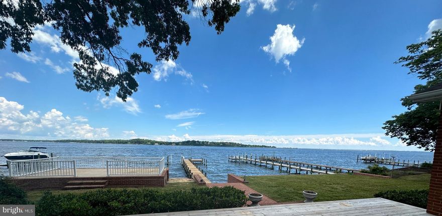 Unparalleled Views of the Magothy River and Chesapeake Bay, watch ships coming and going  while enjoying all the waterfront activities this property has to offer,  this gorgeous property offer 1.23 acre lot, with all brick 4 bedroom 3 bath home with expansive water views as soon as you walk through the front door, wide open floor plan, high ceilings, hardwood floors, Cherry cabinets, S/S appliances, separate refrigerator & freezer, Granite countertops, main level laundry, upstairs features a private primary suite w/raised platform to enjoy the sunrise from bed, super bath including double vanities, separate shower and jetted tub overlooking the water, the primary suite offers a sitting area and walk in closets, there is a large deck and an expansive raised patio overlooking the water w/3 shed/changing rooms below at the waters edge, property boast a large 2 car garage(28x28) w/potential living space or storage space above, there is also another 1 car detached garage/shed in the huge yard with tons of space for sports activities or parking while enjoying this entertainers paradise.  Make your own memories at the gorgeous property.