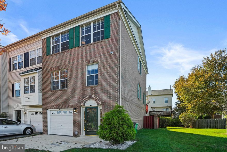 Presenting an exceptional opportunity to own at the epicenter of Largo Town Center.  This sizable end unit has a brick front on a  well appointed south facing lot. With an open and well-lit floor plan, this comfortable and inviting 3-bedroom has two full baths and two half baths spread across three levels. The main level boasts gleaming wood floors with a medium brown tone, a separate dining room, a gas fireplace in the step down living room that has large windows and glass doors that lead to a well proportioned deck. The sun splashed eat in kitchen has continuous granite counters, stainless steel appliances and an abundant amount of storage space. Every bedroom upstairs is spacious with ample closets.  At the entry level there is an open flex space that can easily be converted into a 4th bedroom, family room, gym or office that leads onto a low maintenance fully fenced yard. Parking is easy with a roomy one car garage that also provides extra storage space and a driveway. With every convenience right outside your front door and an oasis out your back door, this home is a blend of comfort and accessibility. Steps away are Largo Town Center Metro Station, IMAX Theatre, UMD Capital Regional Hospital Center, diverse culinary options and local stores.  Close by are FedEx Field, Six Flags, MGM/National Harbor and Prince Georges Community College.  There is easy access to DC, I-95/495/214/202.  A $400 million expansion was just approved by MD board of public works to install a premiere downtown area by Largo Town Center and Fedex Field. Get in now !