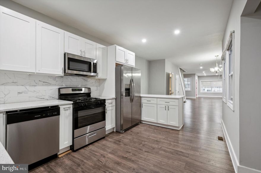 Check out this beautifully remodeled 3-bedroom, 2.5-bath home in a prime Philadelphia location! Featuring front and rear porches, it offers cozy outdoor spaces to relax and enjoy the neighborhood. Inside, you’ll be welcomed by newer luxury vinyl plank flooring, recessed lighting, and an abundance of natural light. The open layout includes a spacious living and dining room, plus a stunning kitchen with quartz countertops, stainless steel appliances, and a breakfast bar. There’s also a nice built-in niche, perfect for adding open shelving, a side table, or a pantry for extra storage. A powder room completes the main floor. Upstairs, the large primary bedroom boasts a built-in closet and an updated ensuite bathroom with a tiled stall shower and vanity. Two additional bedrooms, both nicely sized, offer ample closet space. The middle bedroom enjoys direct access to the full hallway bathroom, featuring a tub-shower combo and vanity. For added convenience, there’s a discreet laundry closet on this floor with a stacked washer and dryer. The finished basement provides additional living space with a walkout to the rear of the home. A full renovation to this home assures comfort for years to come, with all-new insulation, central air, electrical wiring, plumbing, and more. Situated in Allegheny West, this home is near public transportation, making commutes easy, and close to Fairmount Park for outdoor recreation. Its proximity to local shops and schools, including Strawberry Mansion High School, adds to its appeal, making it an excellent choice for anyone seeking a vibrant, connected urban environment in Philadelphia. Schedule an appointment to see your new home today!