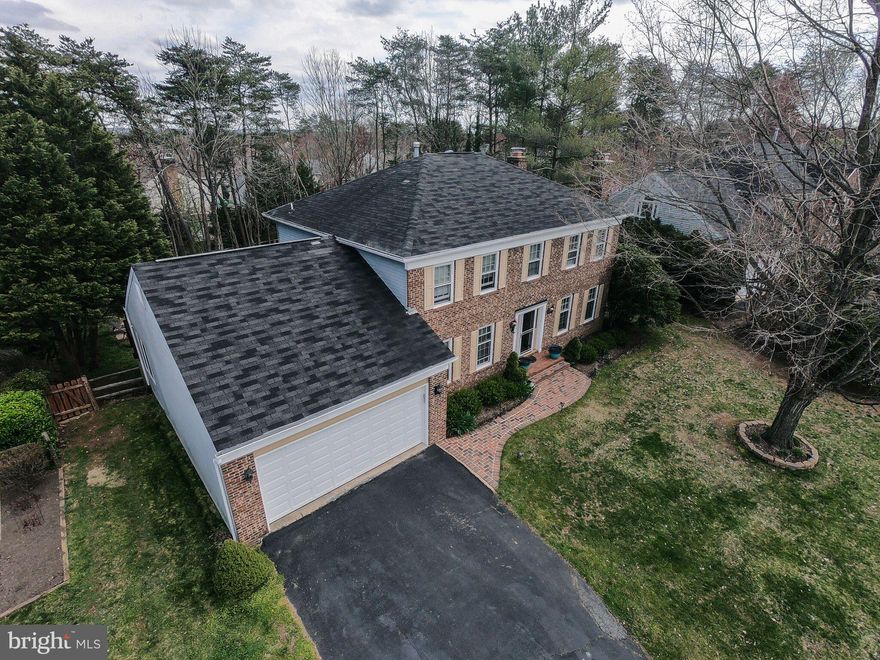 Motivated Seller! Renovated in 2015   5br/2.5bath, over 3200 sq feet, .36 acre, brick front, Brazilian cherry hardwood floors entire main level, remolded bathrooms (Master bath with dual shower), Brand new carpet, Fireplace w/French door to spectacular backyard. Kitchen with granite tops, sunroom & bay window overlooks in ground pool. Dual decks cascade to pool. Large & private fenced yard. New garage door and New HVAC System 2017.