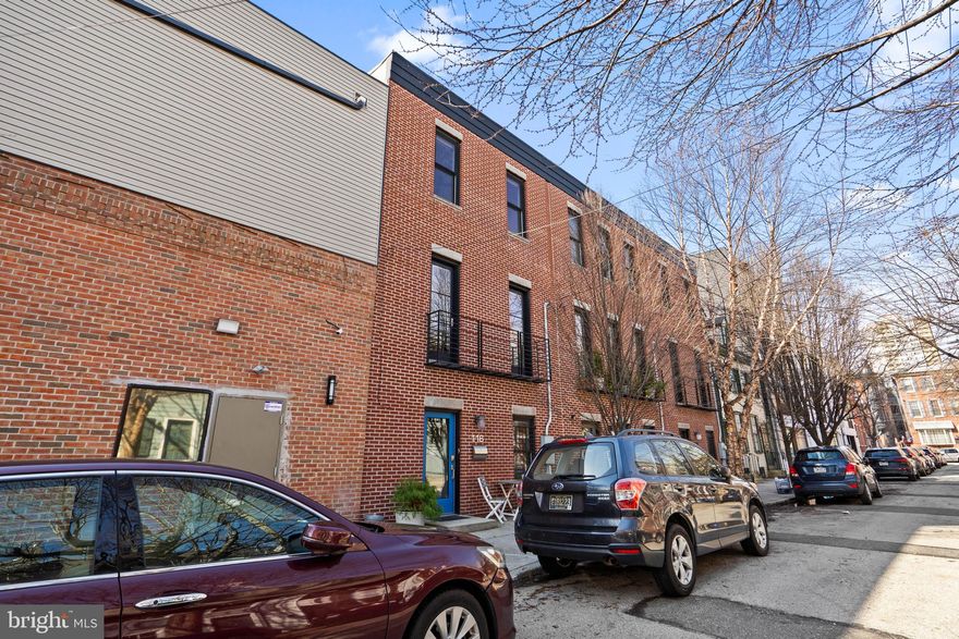 Tucked along charming League Street in desirable Queen Village, this contemporary townhouse blends thoughtful design, natural light, and the rare convenience of private GARAGE PARKING. Built in 2015 by the sustainability-driven Wagner Urban Development, the home reflects a clean, minimal west-coast aesthetic that still feels current and unique among today’s new construction. Inside, 11-12 ft ceilings, skylights, and oversized energy-efficient windows fill the space with light, while warm Provenza hardwood floors and striking custom modern metal staircases add architectural character. The sleek kitchen features Caesarstone countertops and backsplash, a butcher-block island, Kitchen-Aid stainless steel appliances, under-cabinet lighting, and Grohe fixtures.  Adjacent to the kitchen is a bright living room with large doors opening to a Juliet balcony overlooking the historic street – perfect for letting in the spring air. The flexible layout includes 3 bedrooms and 2.5 bathrooms.  The upper level includes 2 bedrooms, a full bath with Grohe fixtures and a Duravit soaking tub, plus a full-size LG washer/dryer – making this a functional and private living area.  The first floor features an additional bedroom with a full bath and an office or sitting area ideal for guest privacy.  The half bath on the main living level is convenient for entertaining. Additional highlights include two-zone heating and cooling, designer lighting throughout, custom closets to maximize storage, and meticulous maintenance by the current owner. You will be located just steps from Royal Izakaya, New Wave Café, For Pete’s Sake, Philadelphia Java and the best of Queen Village.  Washington Avenue provides quick access to major arteries and Interstate 95, making commuting easy.  The home also sits directly behind the transformative Washington Avenue Connector, which will enhance beauty and connectivity to the Delaware River waterfront and surrounding neighborhood amenities. This is a MUST see, schedule your showing today!