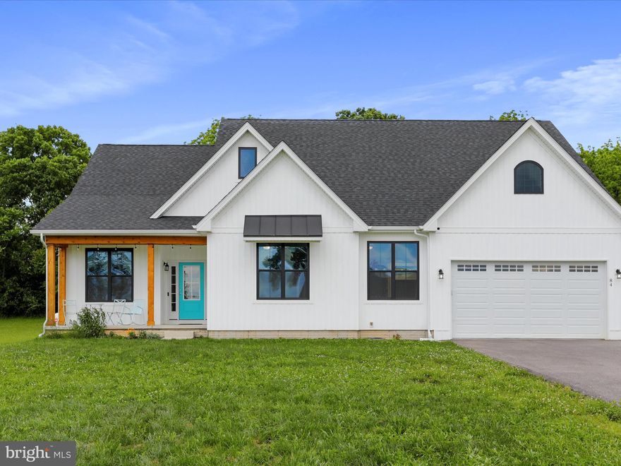 Rustic charm meets contemporary elegance! This like-new, spacious residence boasts an inviting open floor plan and is set on a level and cleared 2+ acre lot. With four bedrooms and two and a half bathrooms, there is plenty of room for everyone. Step into the heart of the home, where the kitchen dazzles with quartz countertops, a large center island with a waterfall counter, stainless steel appliances, and crisp gray cabinetry. The common areas are adorned with elegant gray walls and wainscoting, complemented by luxury vinyl plank flooring throughout. Venture downstairs and imagine the possibilities of the full-size unfinished basement, offering ample storage space or the potential to create additional living areas. Step outside to the spacious yard where countless sunrises and sunsets await you, and for those who love the idea of farm-to-table living, the chicken coop and chickens can be conveyed with the sale. Back inside, wander past the main level laundry room beautifully enhanced by a hand-painted mural. Make your way to the primary suite, with vaulted ceilings, a large closet, and access to the oversized primary bathroom, which features a luxurious freestanding slipper tub. This suite is perfect for unwinding after a long day. Access nearby schools, golf courses, and Washington DC, just 70 miles away! What are you waiting for? Unlock the door to your next chapter in Charles Town!